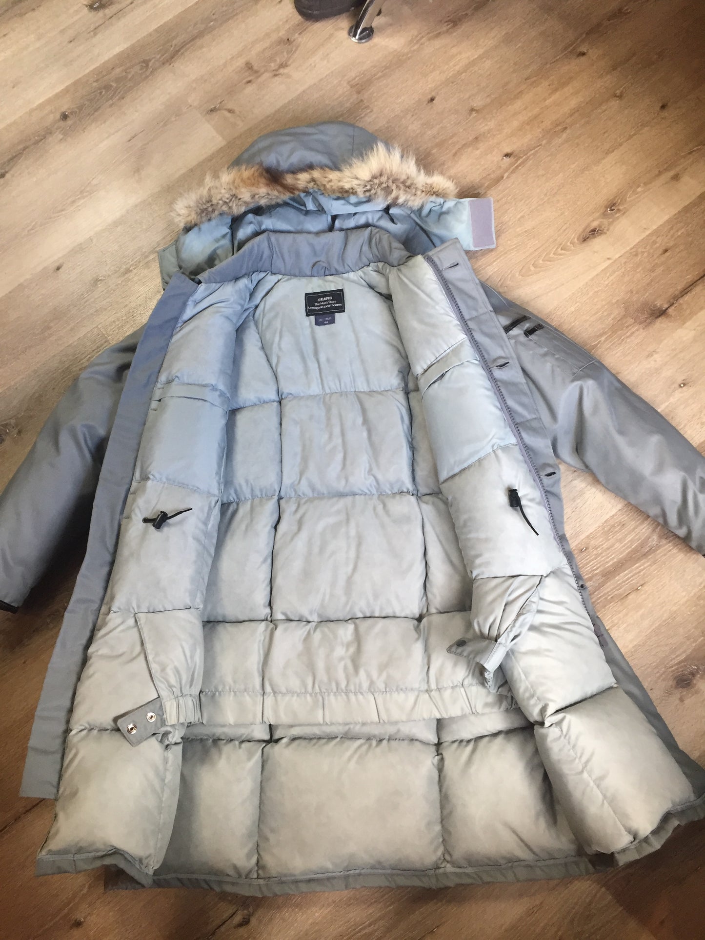 Kingspier Vintage - Sears “The Men’s Store” grey/ blue down filled parka with genuine fur and leather trim, hood, zipper and button closures, slash pockets and flap pockets. Size. 44 tall.