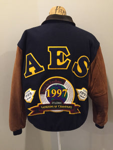 Kingspier Vintage - AES 1997 brown and blue leather and wool varsity jacket with zipper, slash pockets , quilted lining, inside pocket, embroidered emblem on the chest and “AES” printed across the back.