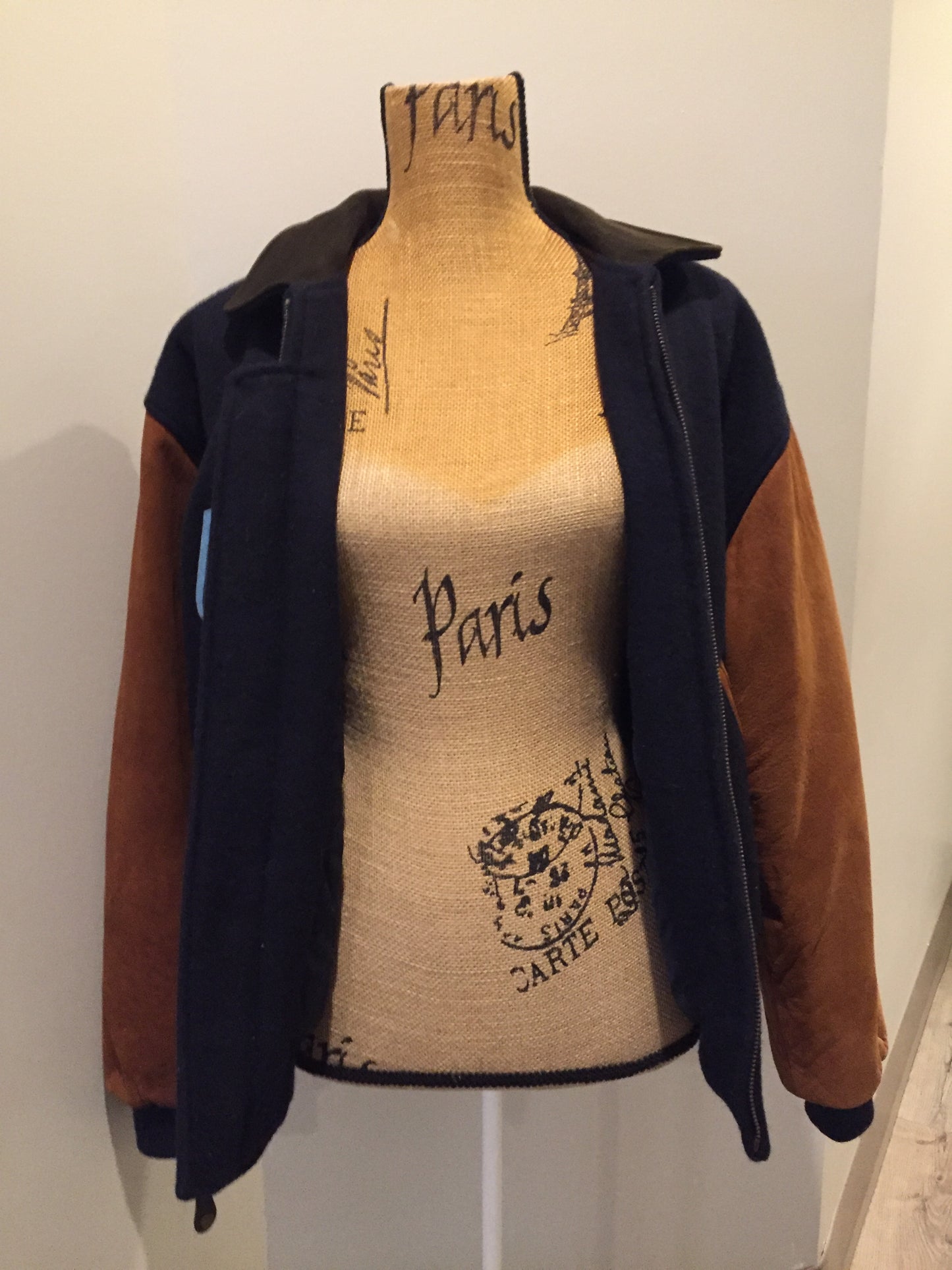 Kingspier Vintage - AES 1997 brown and blue leather and wool varsity jacket with zipper, slash pockets , quilted lining, inside pocket, embroidered emblem on the chest and “AES” printed across the back.