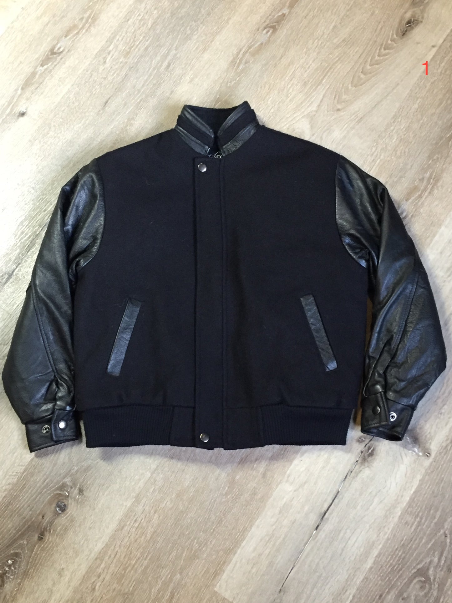Kingspier Vintage - Concord black leather and wool varsity jacket with zipper and snap closures and slash pockets. Size XS.