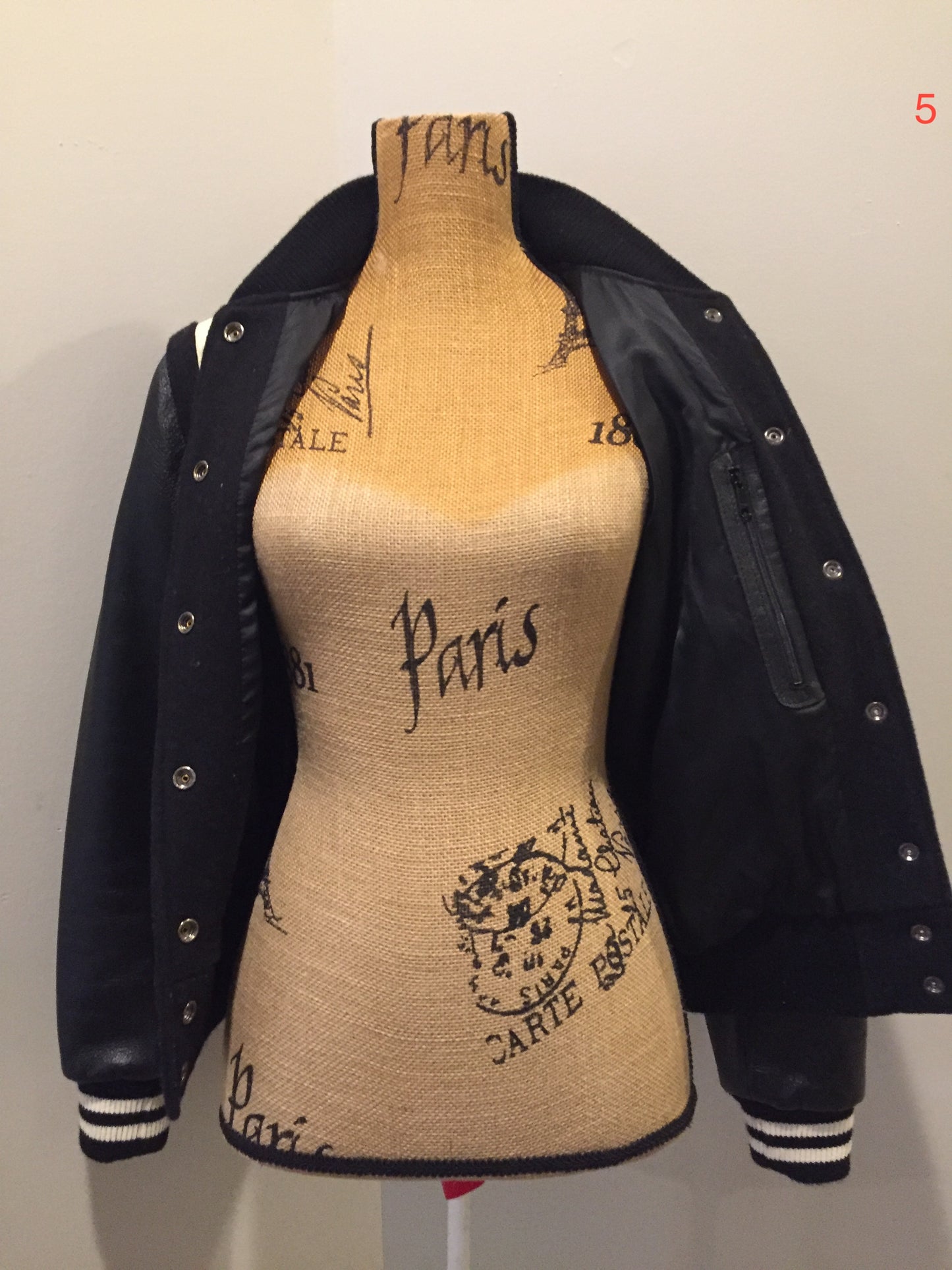 Kingspier Vintage - Roots wool and leather black varsity jacket with white stripe details, knit trim, snap closures, slash pockets and inside pocket. Made in Canada. Ladies size S.