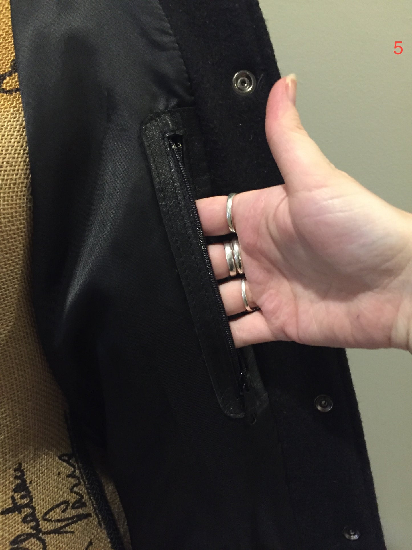 Kingspier Vintage - Roots wool and leather black varsity jacket with white stripe details, knit trim, snap closures, slash pockets and inside pocket. Made in Canada. Ladies size S.