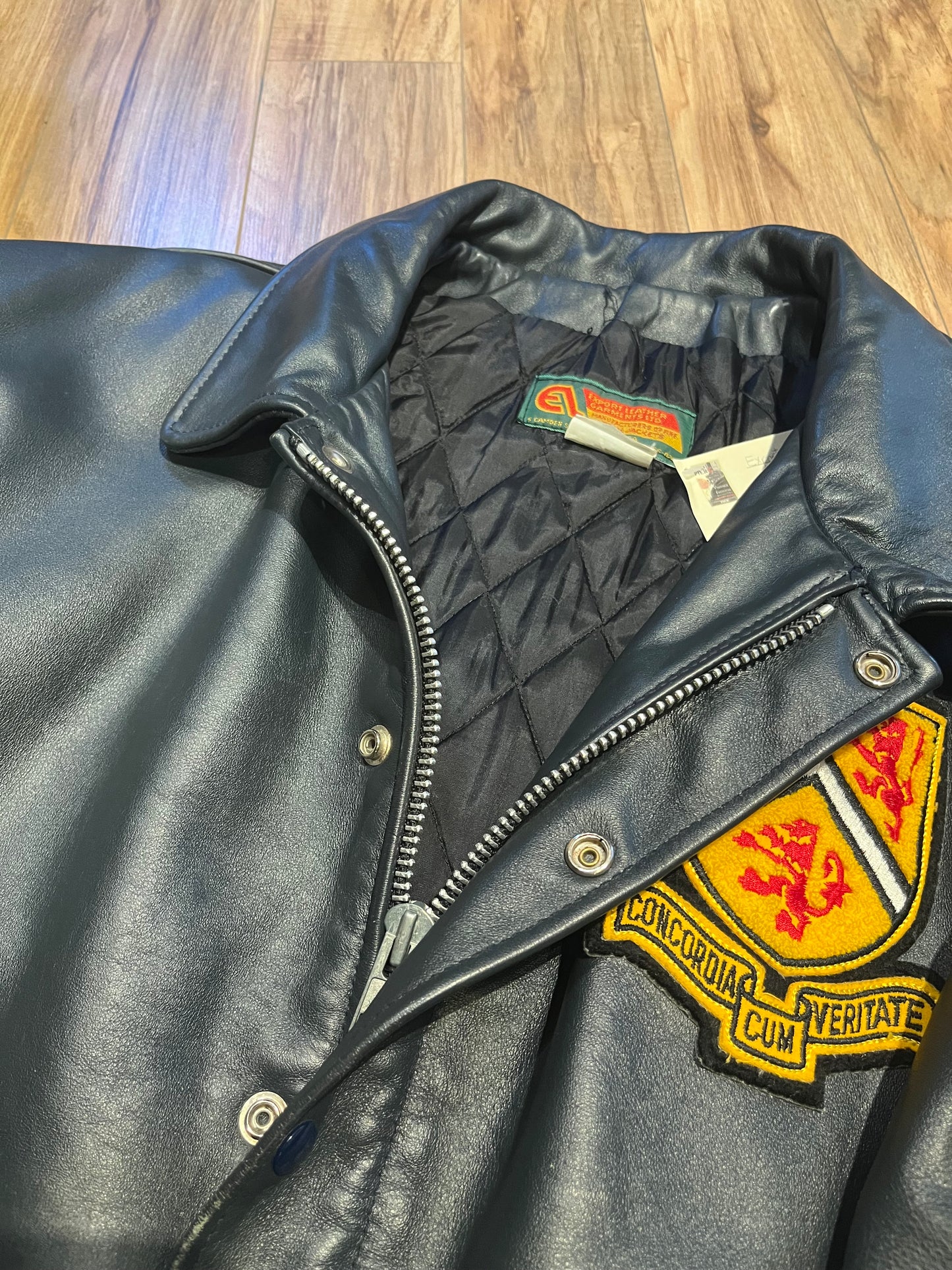 Vintage 70’s Waterloo Engineering Letterman’s leather varsity jacket by Export Leather Garments LTD.
Jacket features embroidered details on the chest, arms and back, two front pockets, zipper and snap closures and a quilted lining.
Made in Canada.
Size 52.