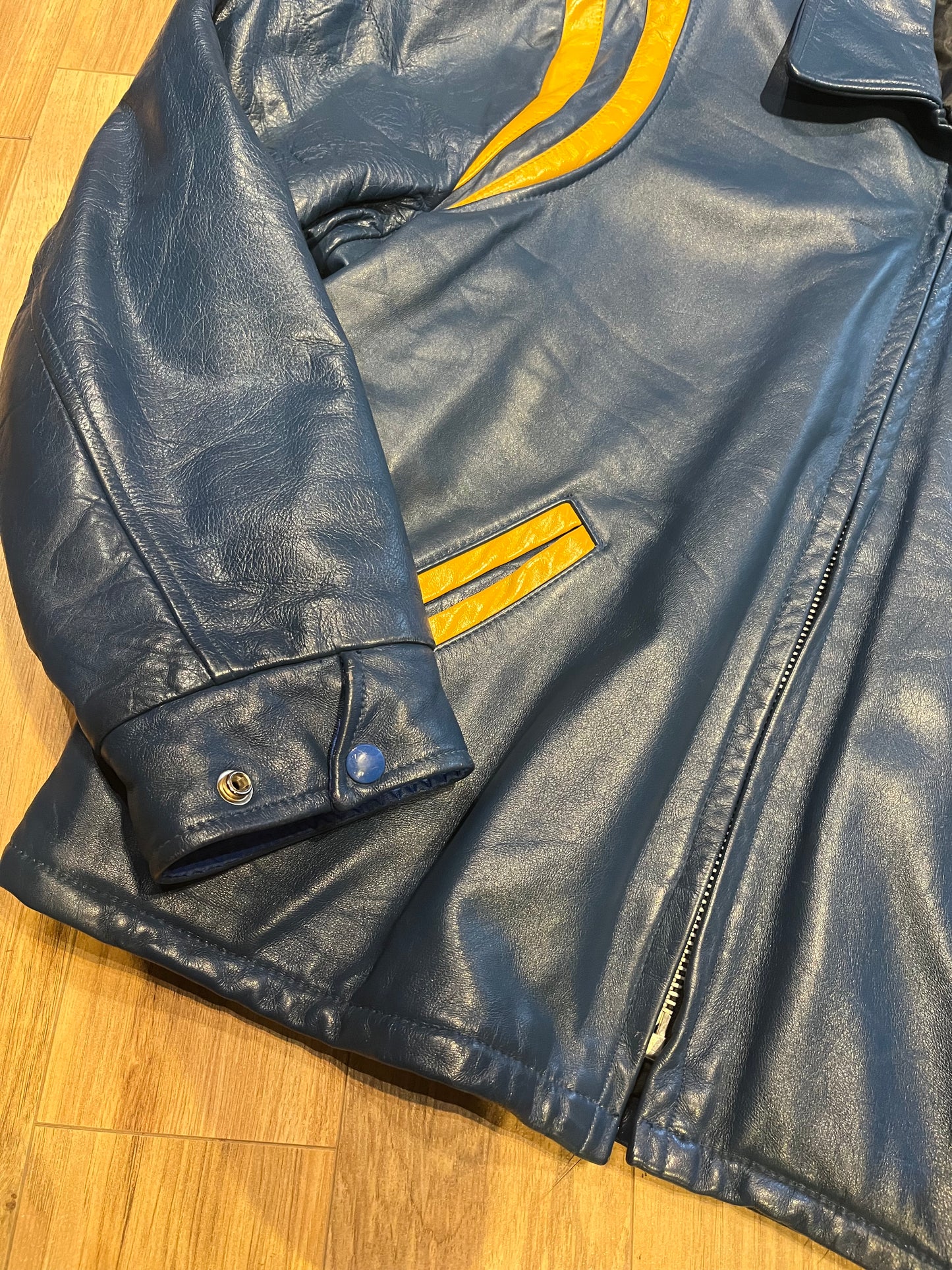 Bonwitt of Winnipeg blue and yellow leather varsity jacket.
Jacket features a zipper closure, two front pockets and a quilted lining.
Made in Canada.
Size XL