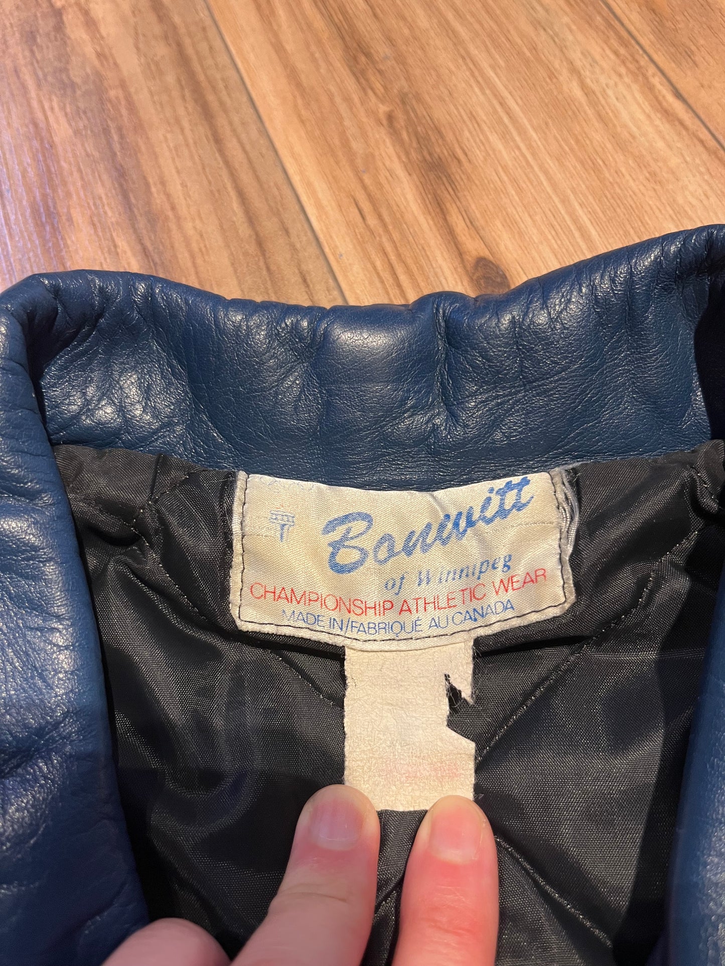 Bonwitt of Winnipeg blue and yellow leather varsity jacket.
Jacket features a zipper closure, two front pockets and a quilted lining.
Made in Canada.
Size XL
