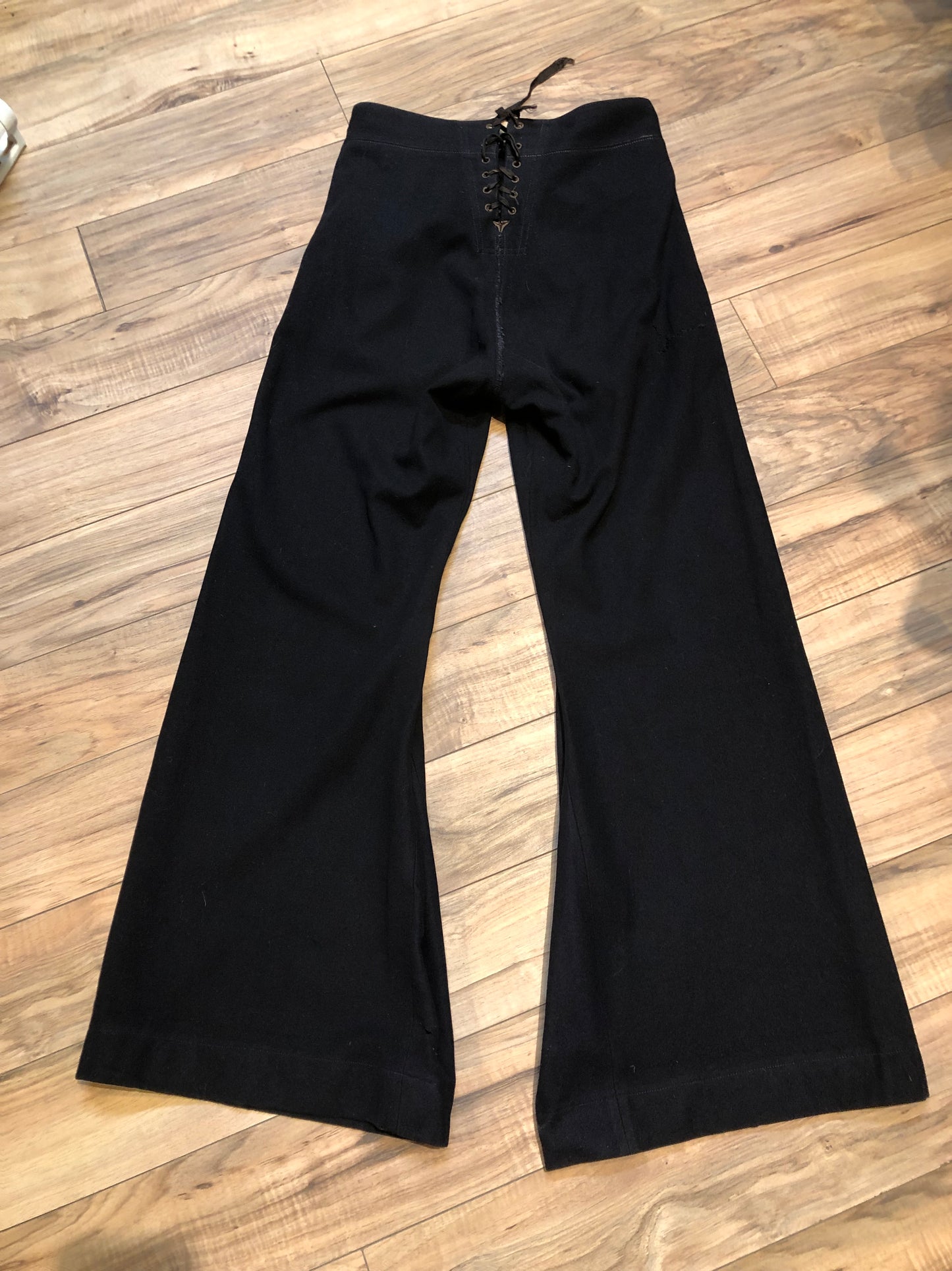 Kingspier Vintage - Vintage US Naval Clothing Factory very rare cracker jack pants with lace up closure in the back and button up front flap, “Boo Laundry” is written on the inside pocket.
Made in USA.