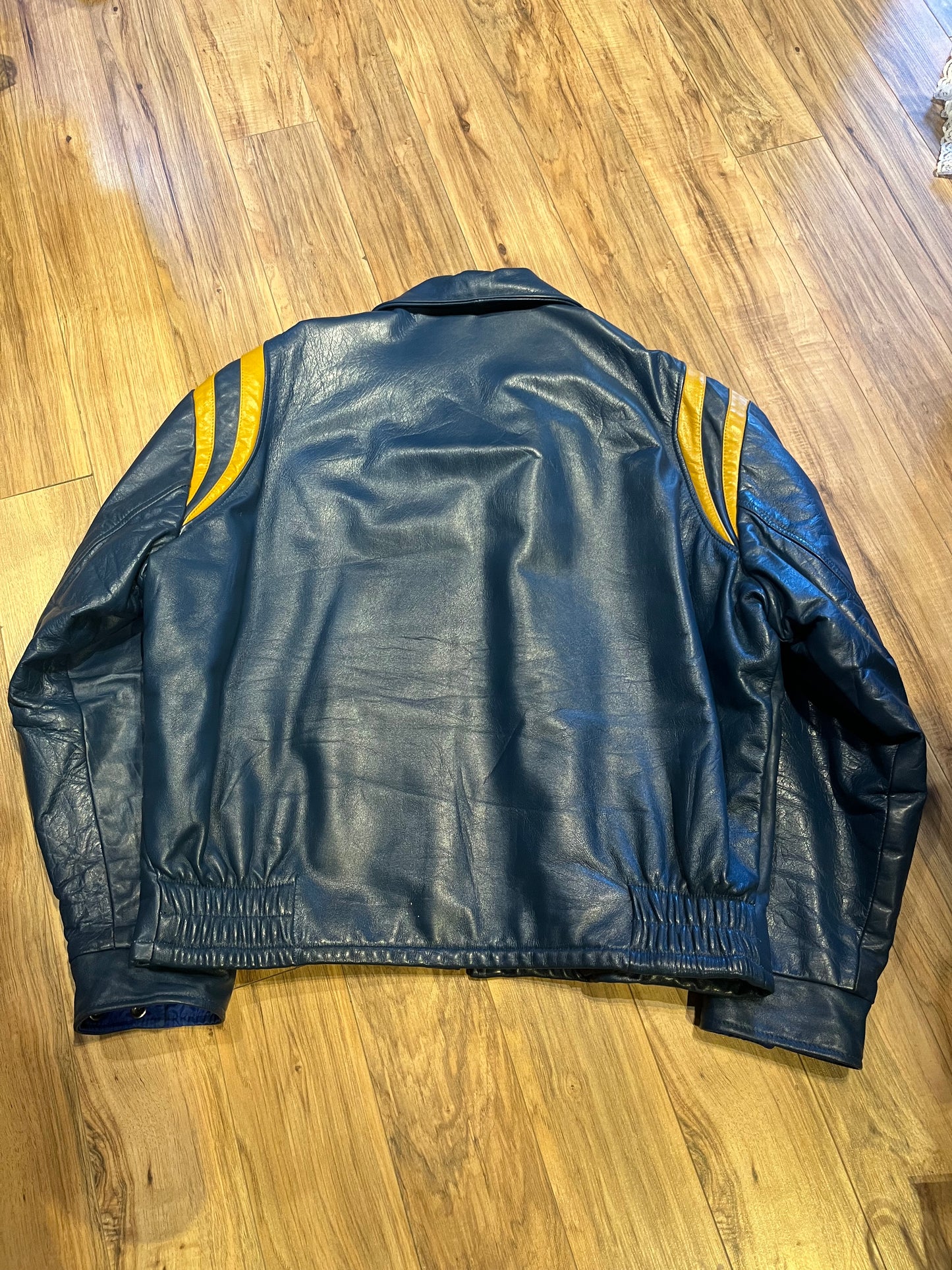 Bonwitt of Winnipeg blue and yellow leather varsity jacket.
Jacket features a zipper closure, two front pockets and a quilted lining.
Made in Canada.
Size XL