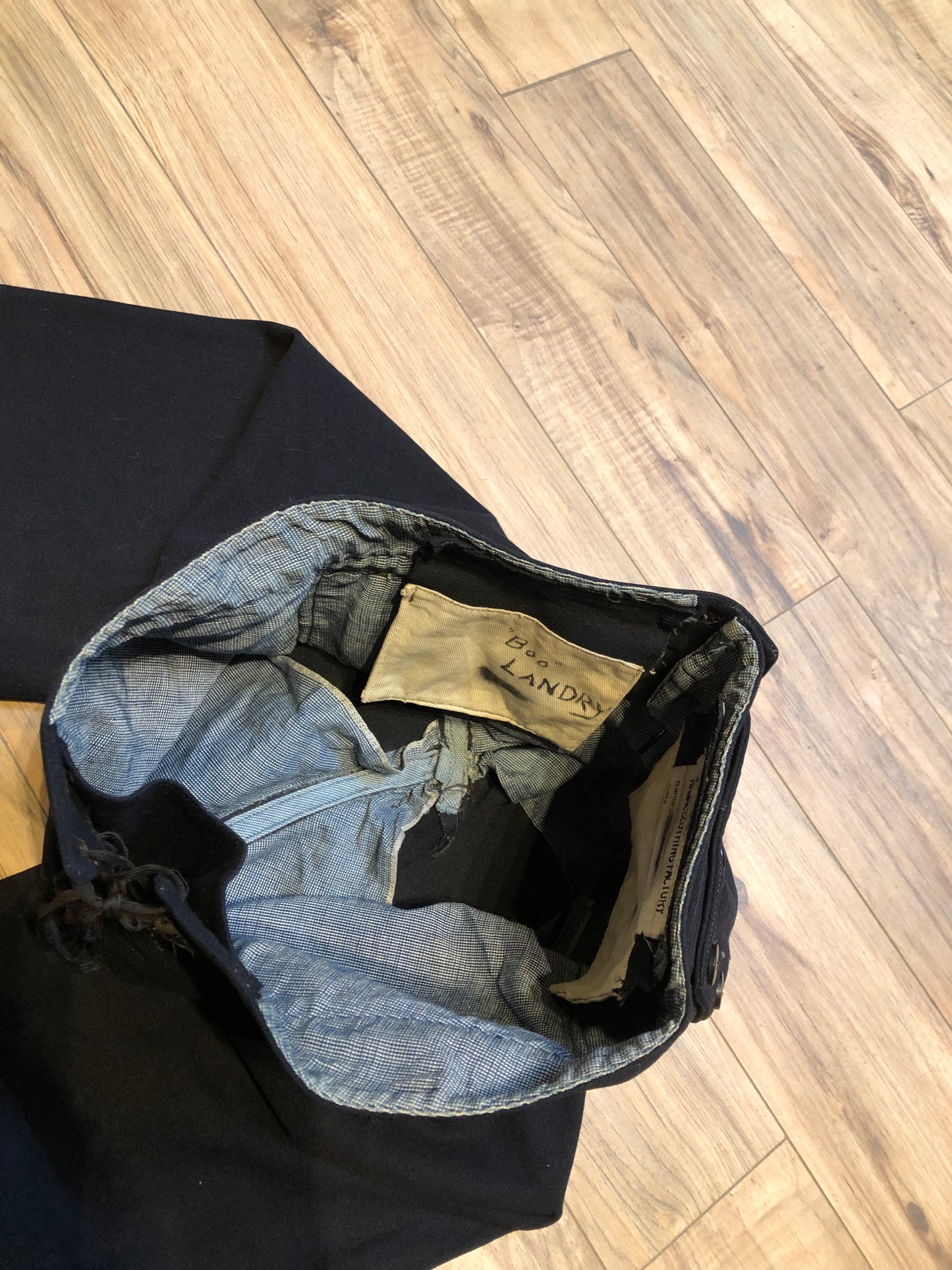 Kingspier Vintage - Vintage US Naval Clothing Factory very rare cracker jack pants with lace up closure in the back and button up front flap, “Boo Laundry” is written on the inside pocket.
Made in USA.