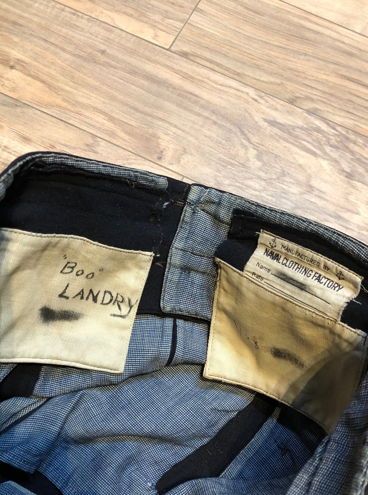 Kingspier Vintage - Vintage US Naval Clothing Factory very rare cracker jack pants with lace up closure in the back and button up front flap, “Boo Laundry” is written on the inside pocket.
Made in USA.