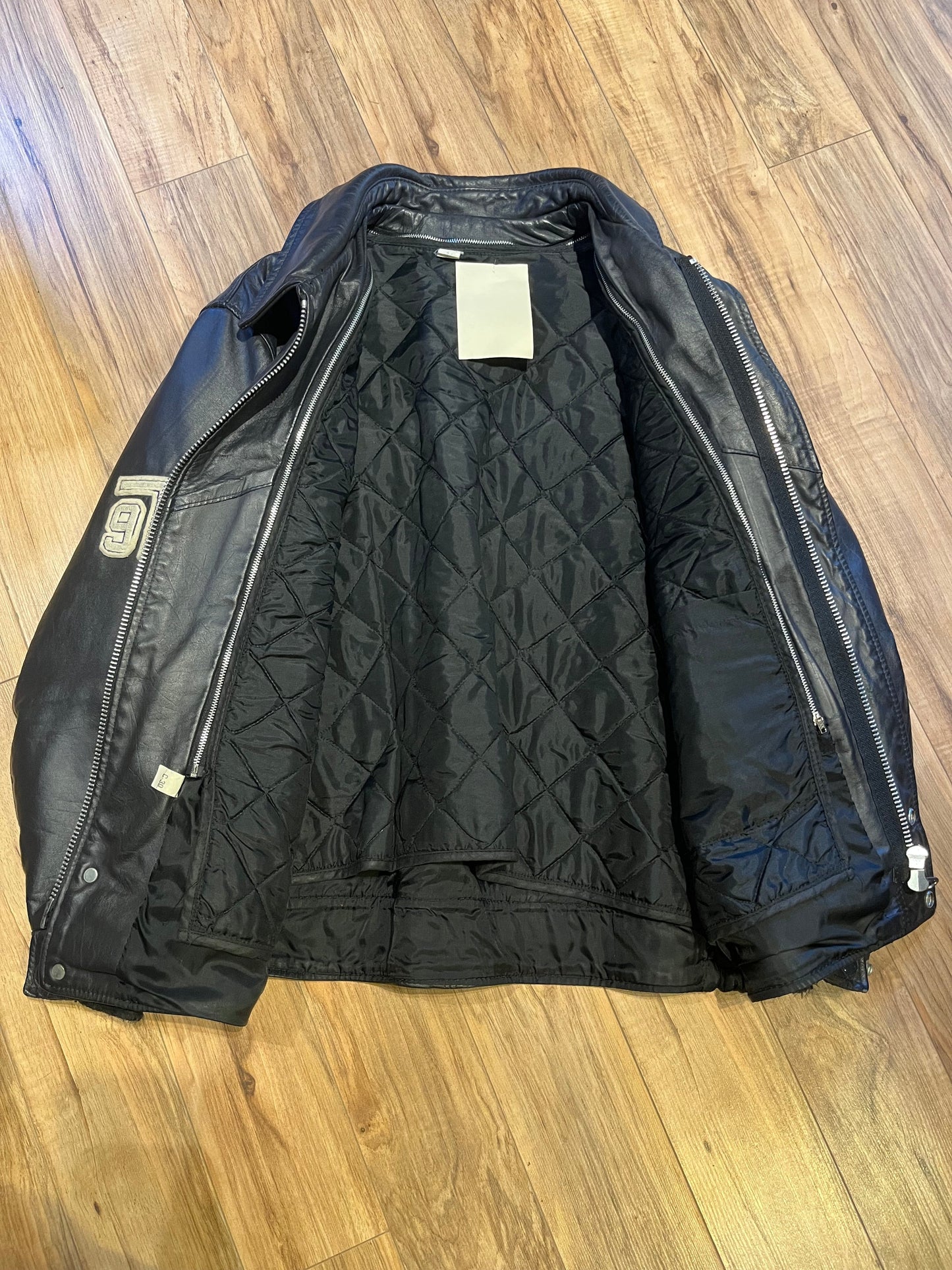 Vintage University of Toronto 1998 English Department Leather Varsity Jacket.
Jacket features embroidered details on the chest, arms and back, two front pockets, zipper and snap closures and a zip out quilted lining.
Size 46.