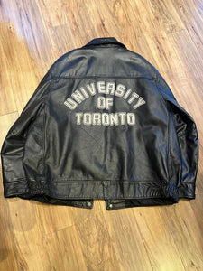 Vintage University of Toronto 1998 English Department Leather Varsity Jacket.

Jacket features embroidered details on the chest, arms and back, two front pockets, zipper and snap closures and a zip out quilted lining.

Size 46.