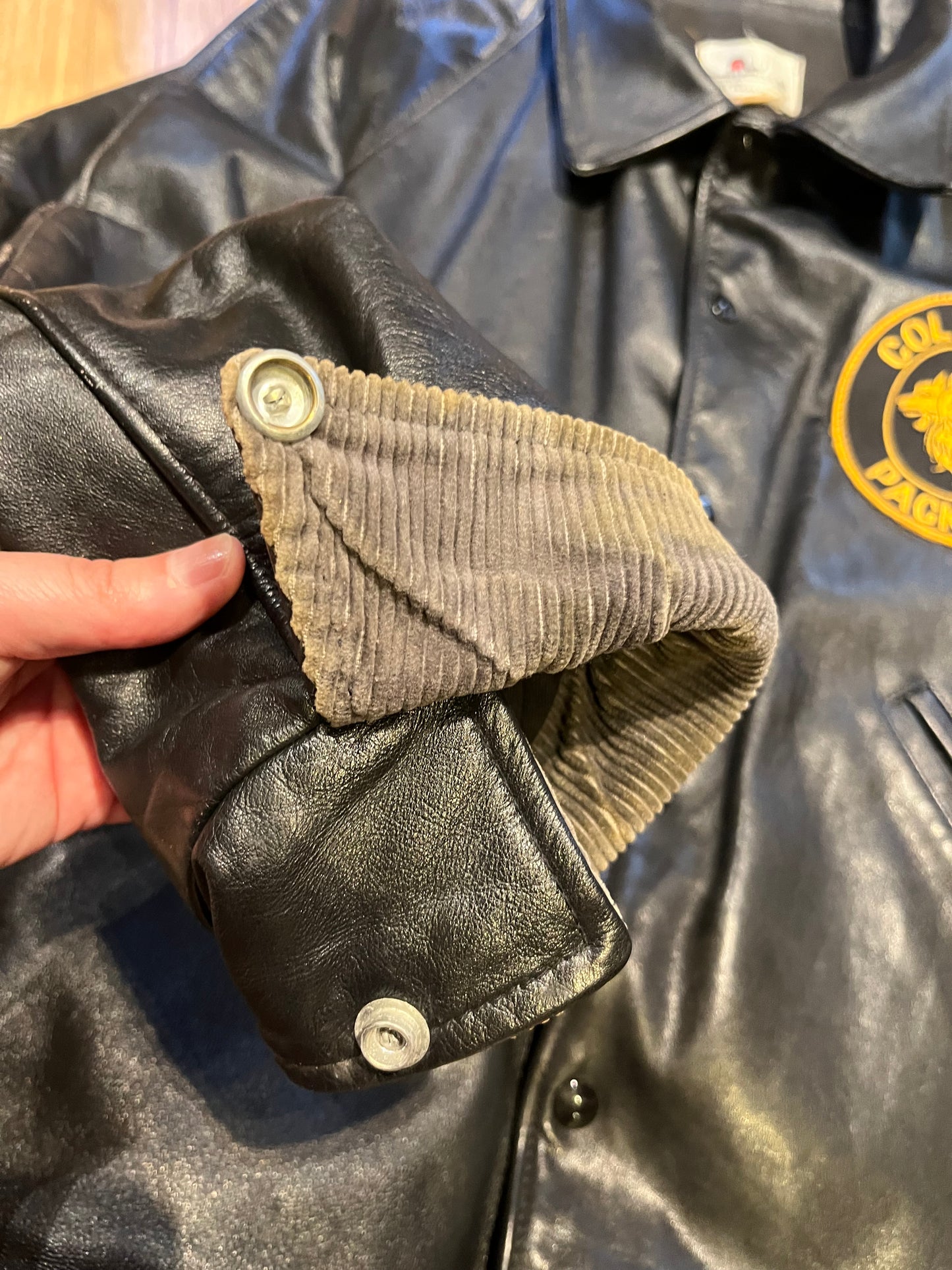 Vintage Cold Lake Packers Leather Varsity Jacket by Athletes Wear Co. LTD.
Jacket features embroidered detail on the chest, two front pockets and snap closures.
Made in Canada.
Chest 46”.