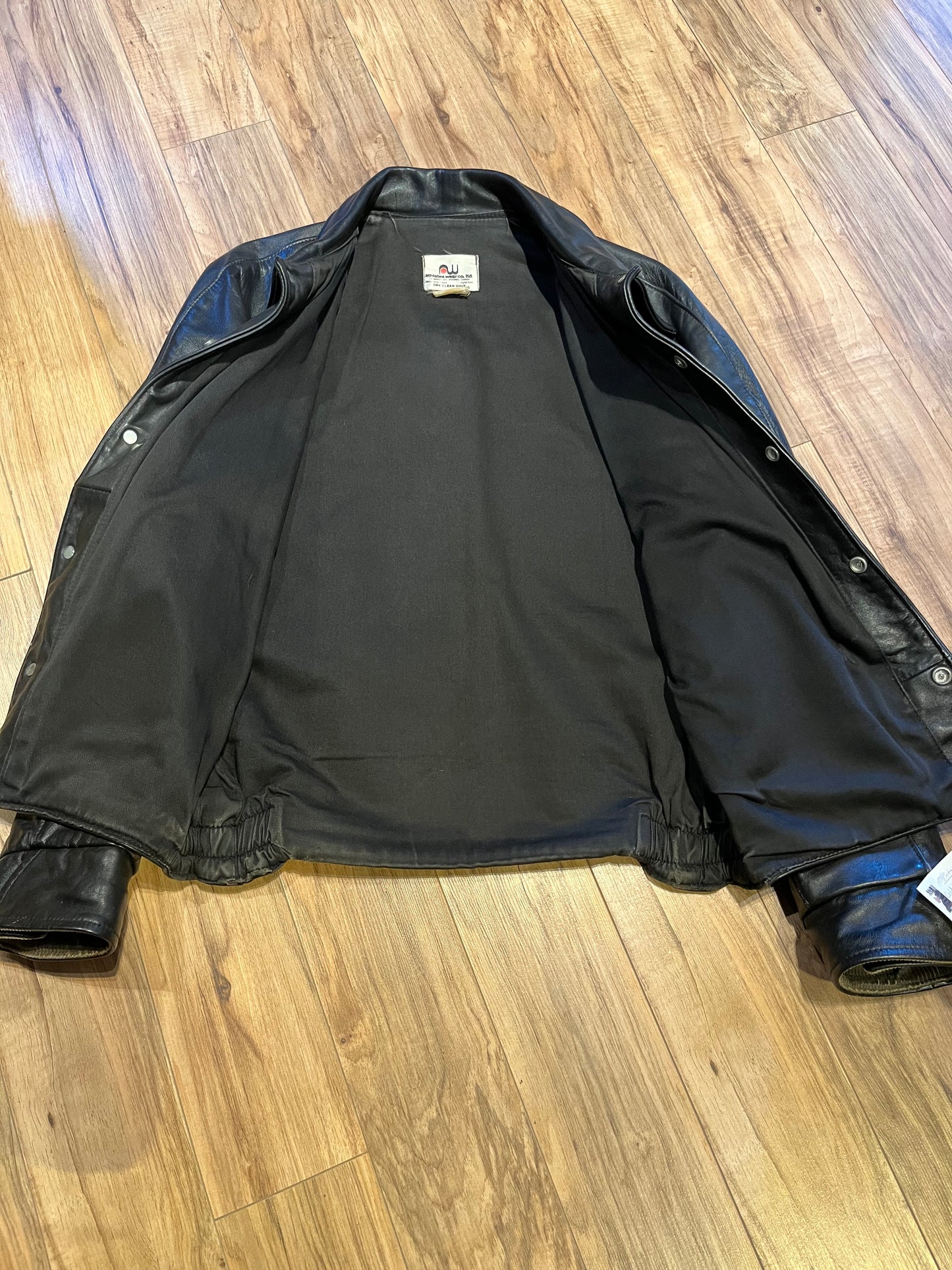 Vintage Cold Lake Packers Leather Varsity Jacket by Athletes Wear Co. LTD.
Jacket features embroidered detail on the chest, two front pockets and snap closures.
Made in Canada.
Chest 46”.