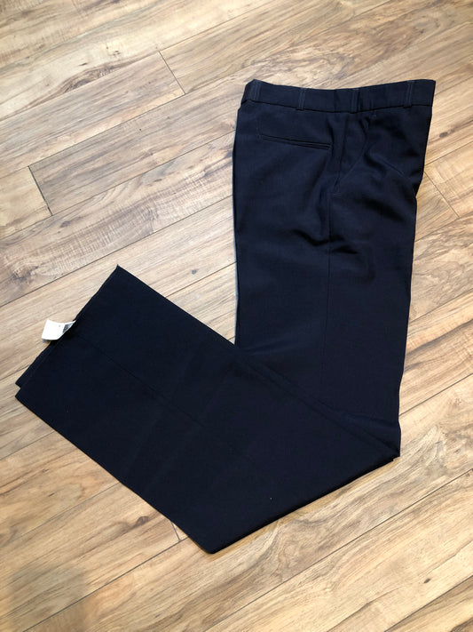 Kingspier Vintage - Vintage deadstock Eaton Birkdale 55% Polyester/ 45% wool dress pants with straight leg, mis rise, zip fly and front and back pockets.
Made in Czechoslovakia