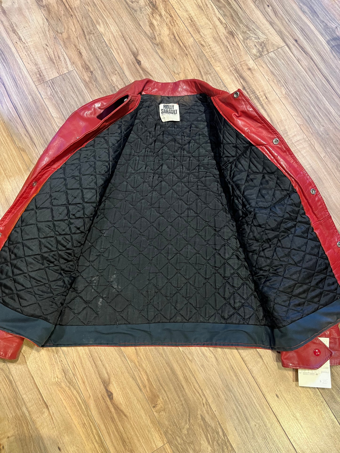 Vintage 70’s Ottawa 67s Red Leather Varsity Jacket by Rolly Sarault.
Jacket features embroidered details on the chest, snap closures, quilted lining and two front pockets.
Made in Canada.
Chest 46”.