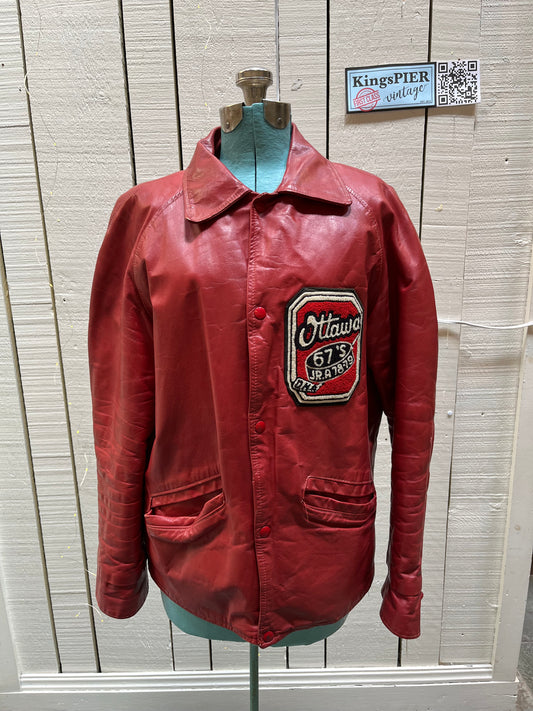 Vintage 70’s Ottawa 67s Red Leather Varsity Jacket by Rolly Sarault.
Jacket features embroidered details on the chest, snap closures, quilted lining and two front pockets.
Made in Canada.
Chest 46”.