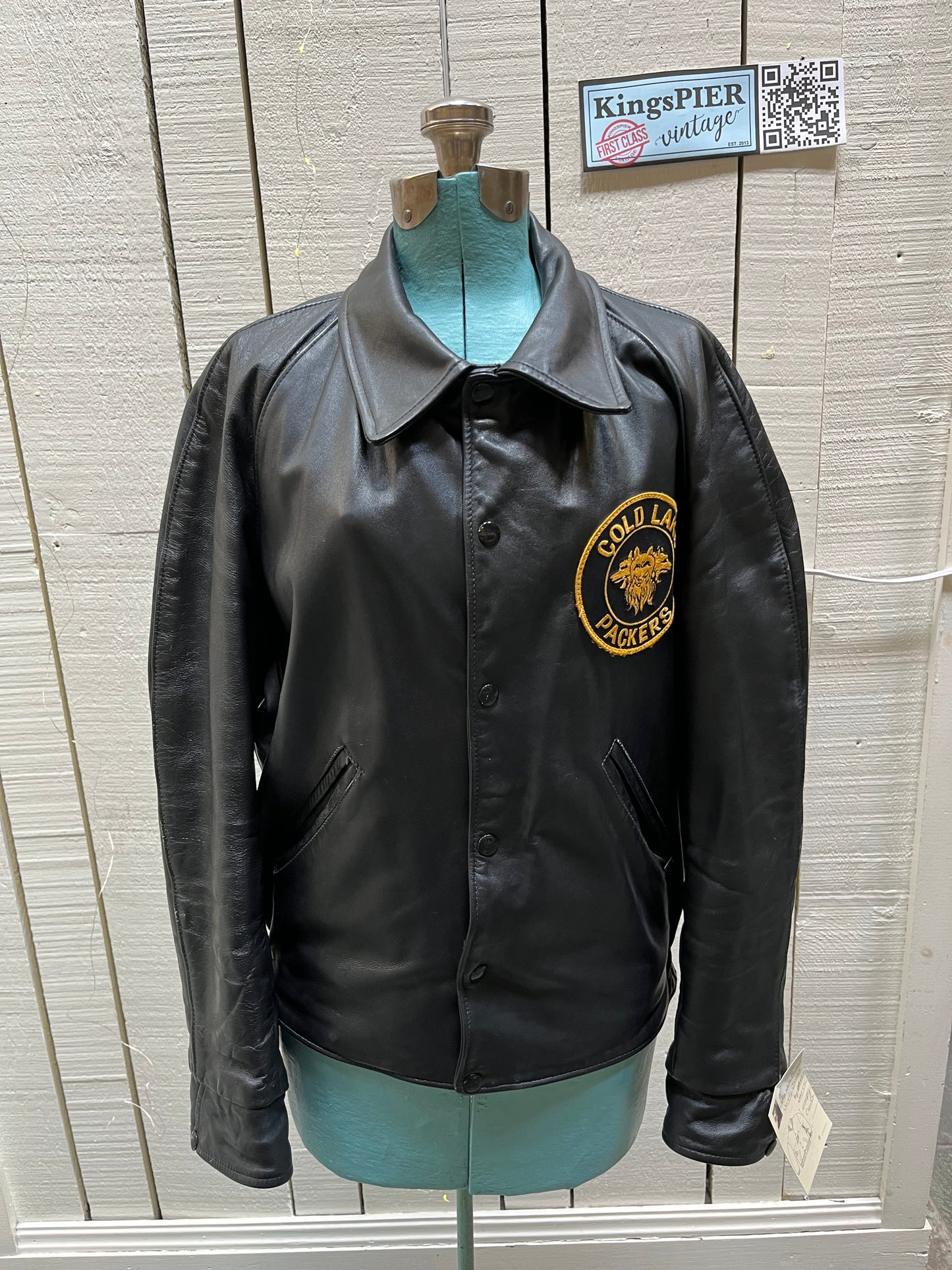 Vintage Cold Lake Packers Leather Varsity Jacket by Athletes Wear Co. LTD.
Jacket features embroidered detail on the chest, two front pockets and snap closures.
Made in Canada.
Chest 46”.