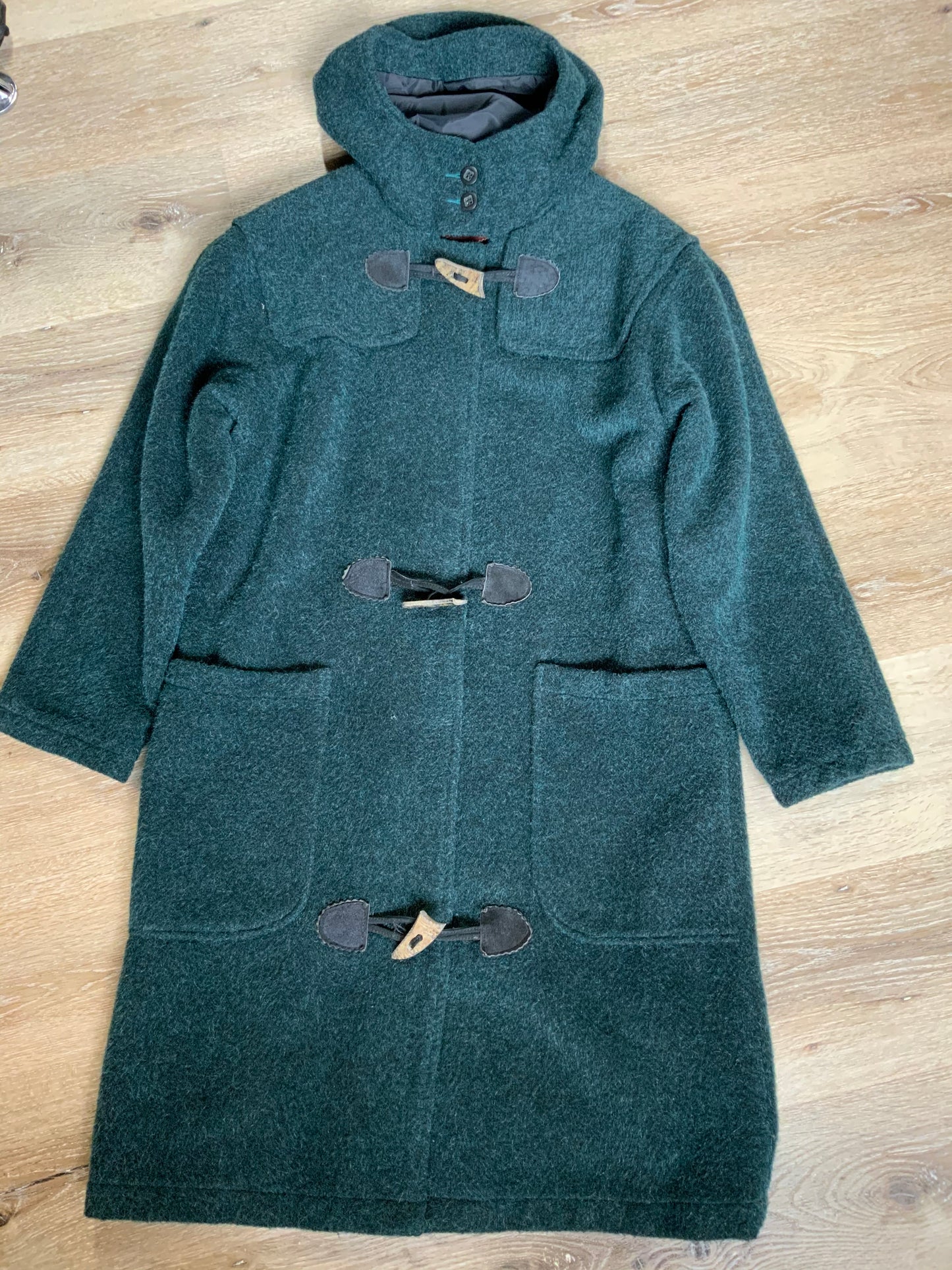 Kingspier Vintage - “The Woolrich Woman” dark teal wool and mohair blend duffle coat with hood, pockets, three wooden toggles, inside snaps and a leather Woolrich label. Made in the USA. Fits a size small.