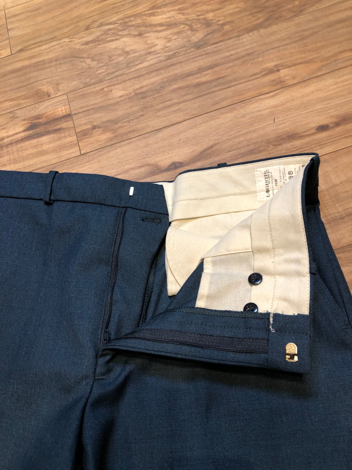 Kingspier Vintage - Logistik blue wool blend (65% wool/ 35% polyester) heavy weight dress pants with zip fly, straight leg, mid rise and front and back pockets,
Made in Canada.