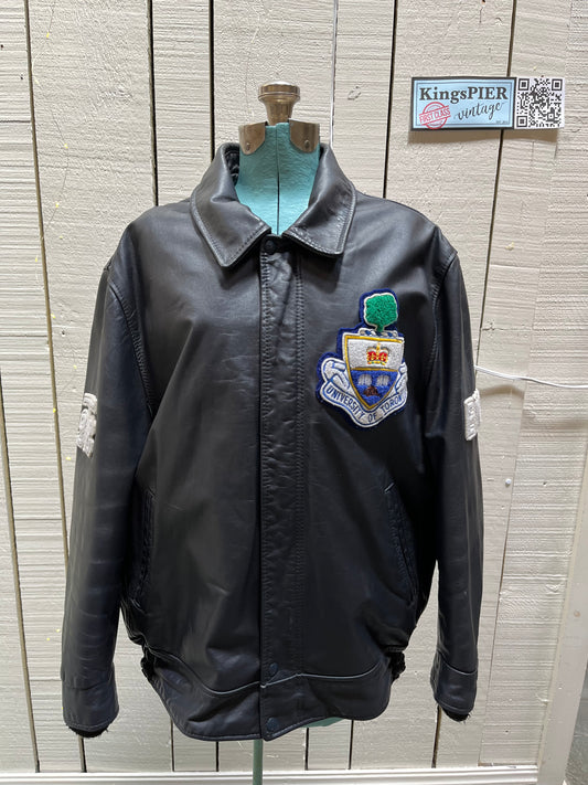 Vintage University of Toronto 1998 English Department Leather Varsity Jacket.
Jacket features embroidered details on the chest, arms and back, two front pockets, zipper and snap closures and a zip out quilted lining.
Size 46.