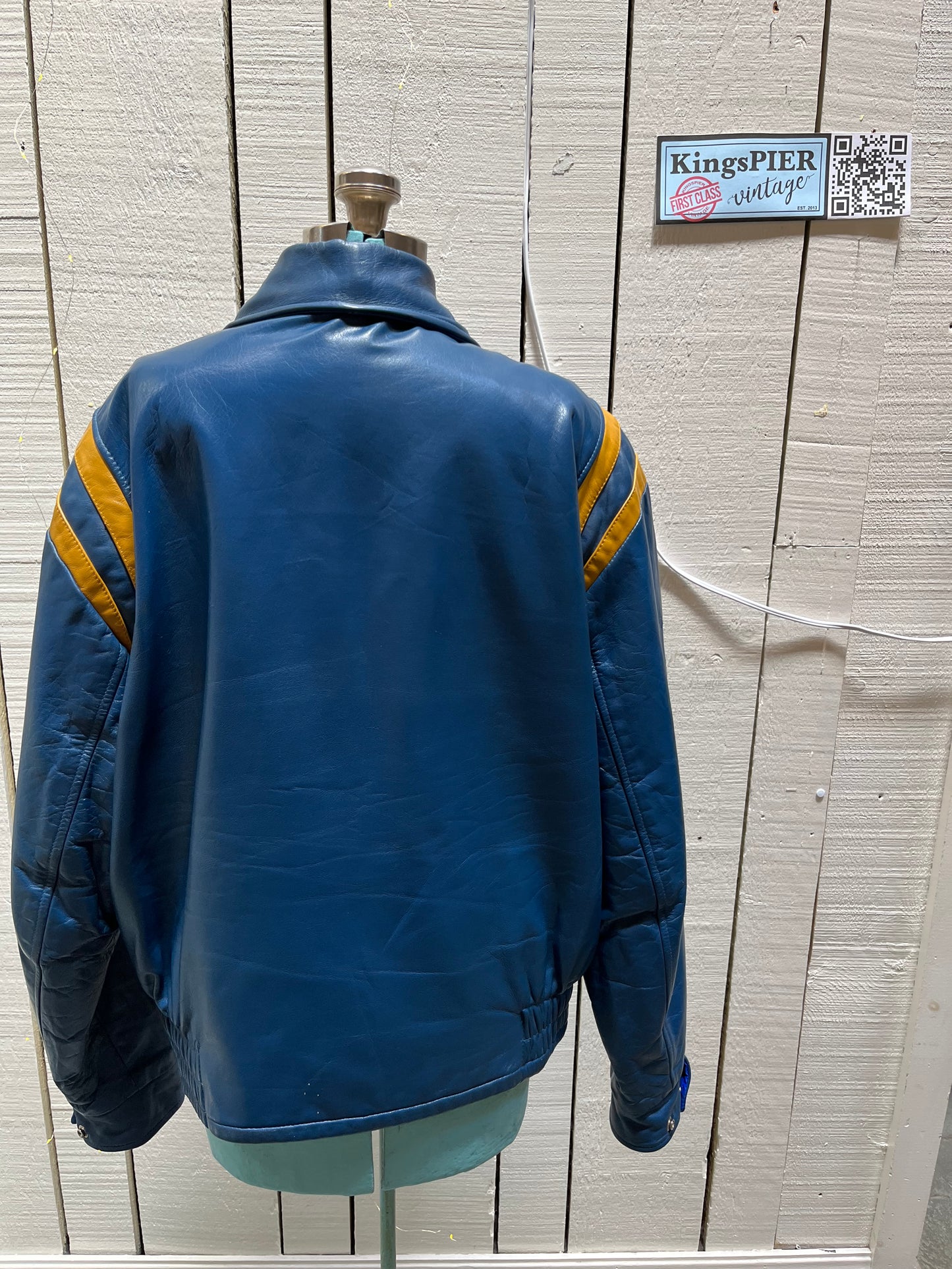 Bonwitt of Winnipeg blue and yellow leather varsity jacket.
Jacket features a zipper closure, two front pockets and a quilted lining.
Made in Canada.
Size XL