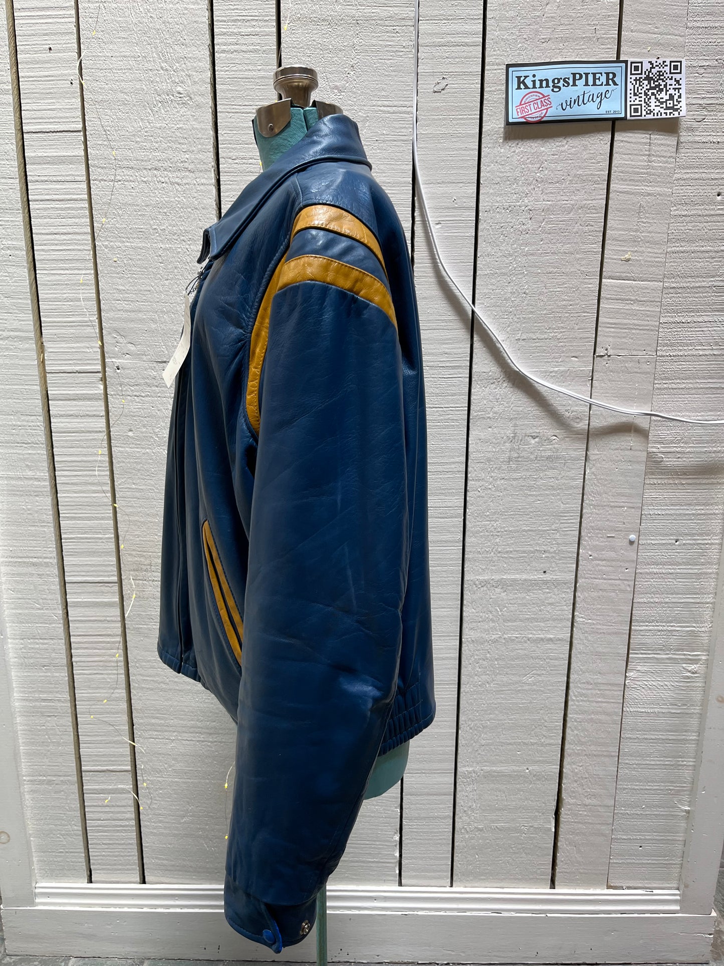 Bonwitt of Winnipeg blue and yellow leather varsity jacket.
Jacket features a zipper closure, two front pockets and a quilted lining.
Made in Canada.
Size XL