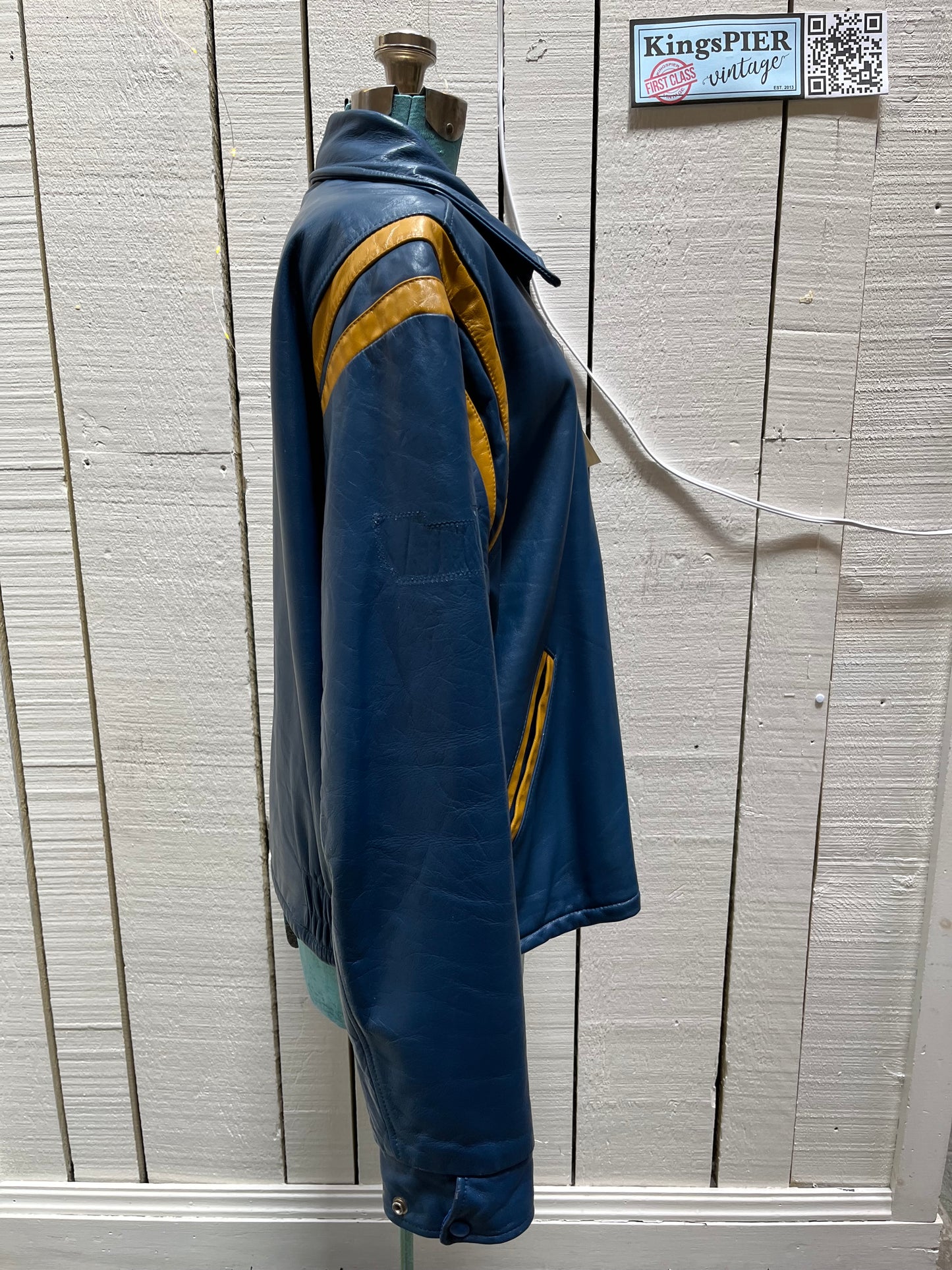 Bonwitt of Winnipeg blue and yellow leather varsity jacket.
Jacket features a zipper closure, two front pockets and a quilted lining.
Made in Canada.
Size XL