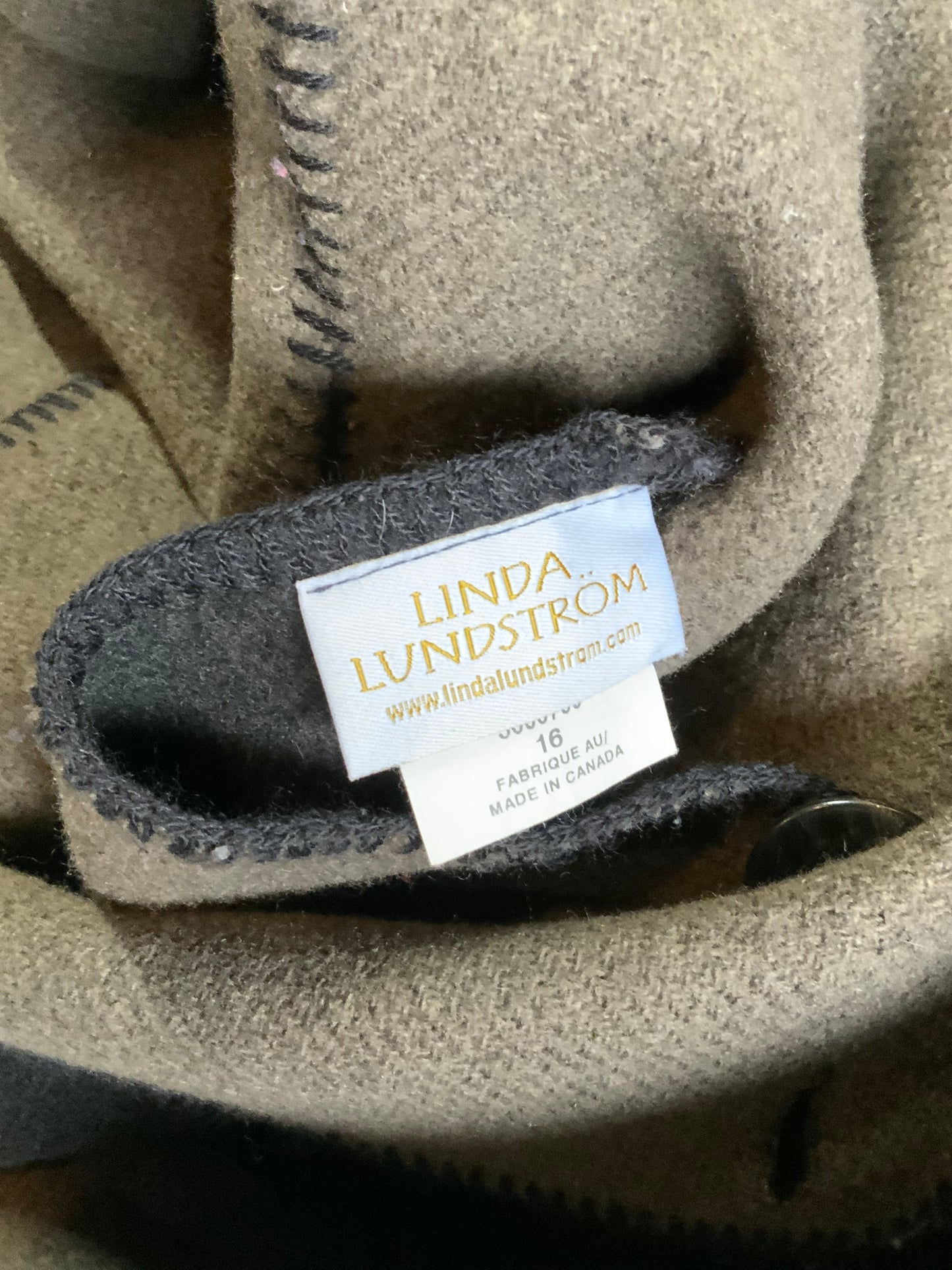 Kingspier Vintage - Linda Lundstrom full length black and brown reversible wool coat, double breasted with a hood and pockets on both sides. Made in New Glasgow, Nova Scotia. Size 16.
