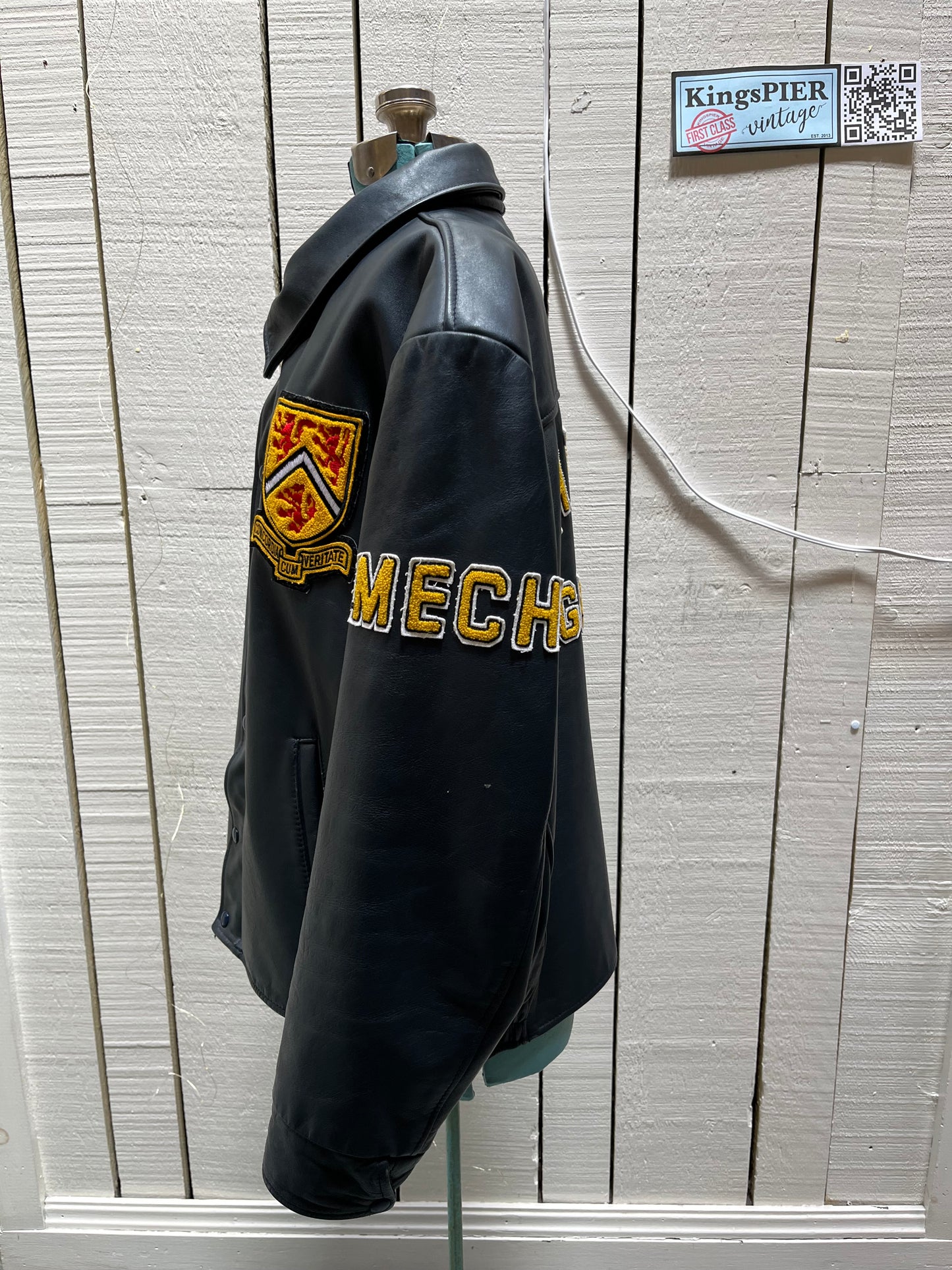 Vintage 70’s Waterloo Engineering Letterman’s leather varsity jacket by Export Leather Garments LTD.
Jacket features embroidered details on the chest, arms and back, two front pockets, zipper and snap closures and a quilted lining.
Made in Canada.
Size 52.