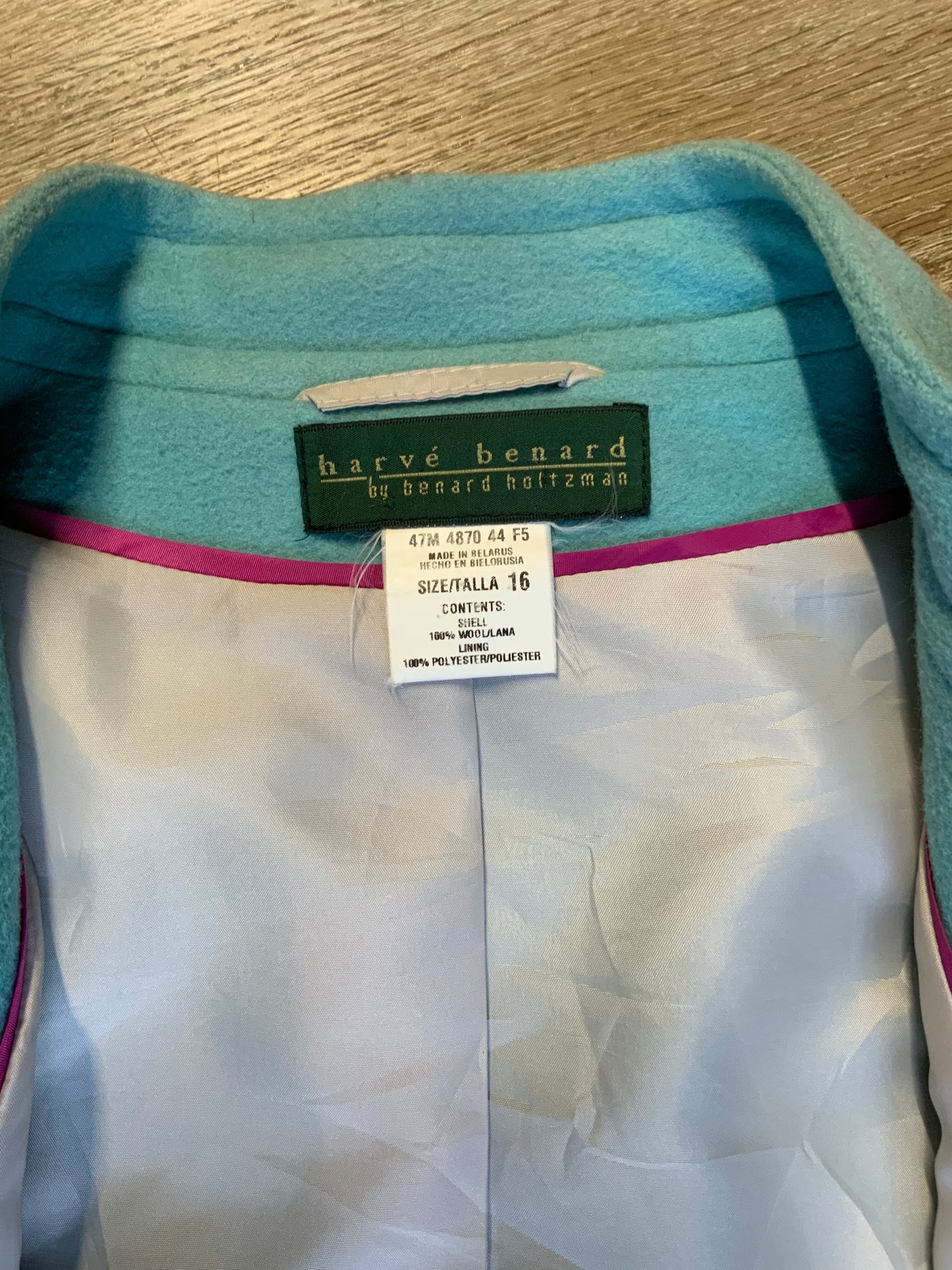 Kingspier Vintage - Harve Benard by Benard Holtzman light blue wool blend double breasted coat with two lovely brown front button closures and flat front pockets. Lining is off white with a fun hot pink trim. Made in Balarus. Size 16 but fits small.