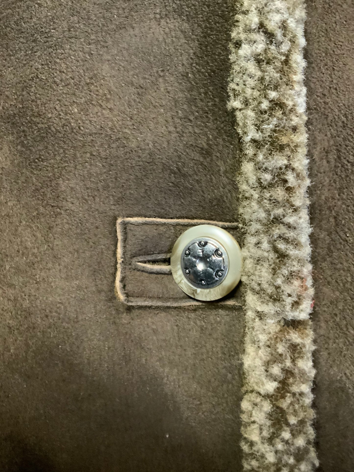 Kingspier Vintage - Epsilon full length moss green 100% wool coat with sheepskin panel running down the front. button closures with unique flower detail, front pockets and a zip out inside lining. Made in Canada. Fits a size large.