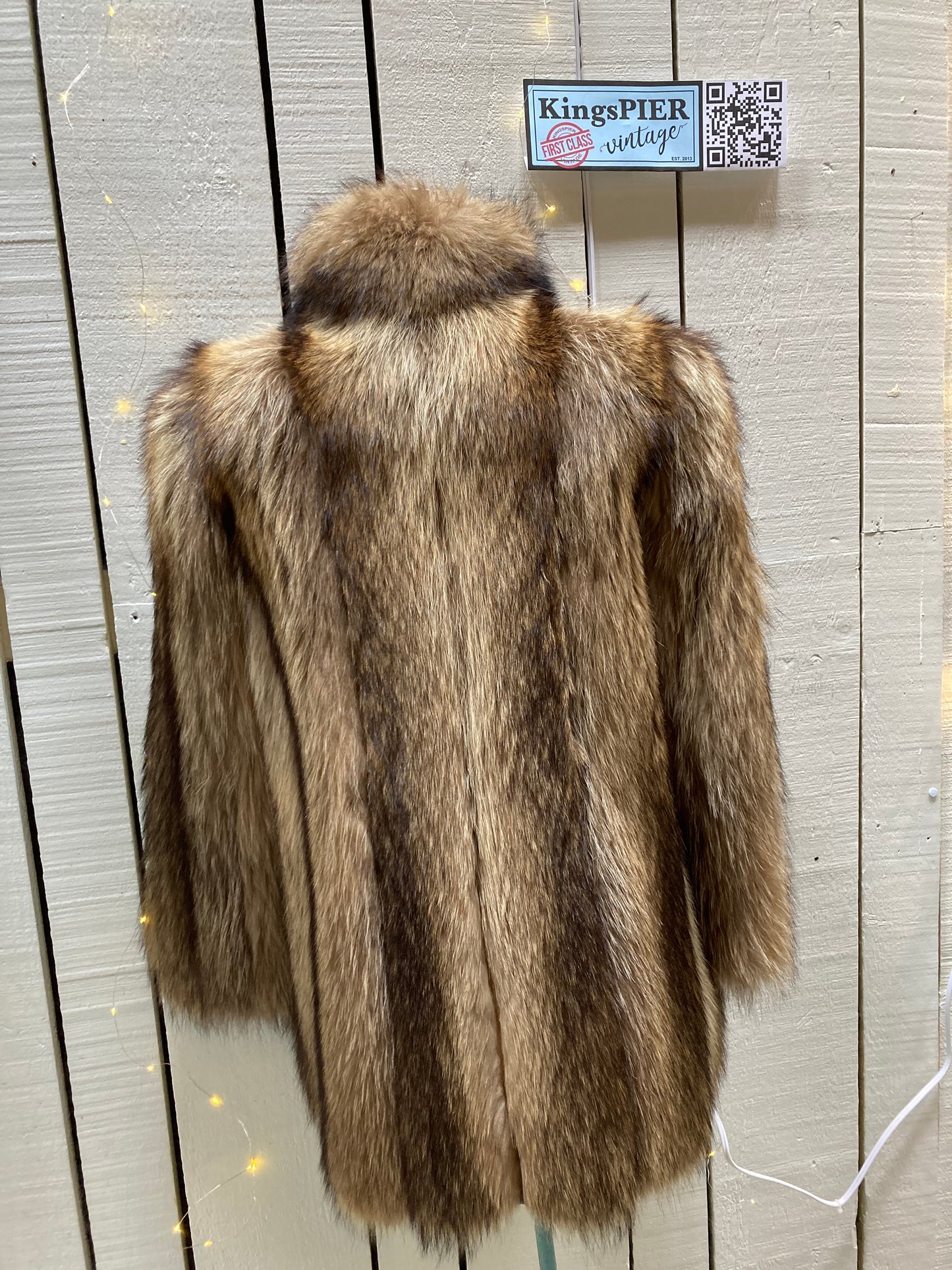 Kingspier Vintage - Vintage Greenwich Furs light brown fur coat with hook and eye closures and two front pockets.
Made in USA