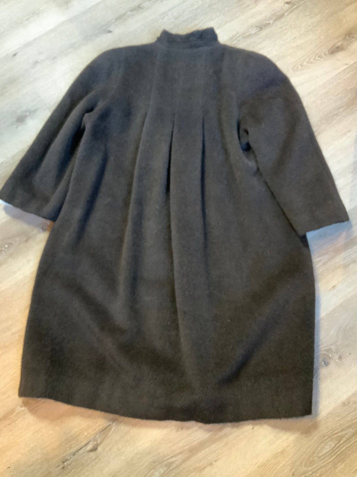 Kingspier Vintage - Regency 1970’s dark brown alpaca wool full length coat with front pockets and buttons, shoulder pads and pleating detail in the back. Features an ILGWU, Made in the USA label on inner lining. Fits a Size 8.