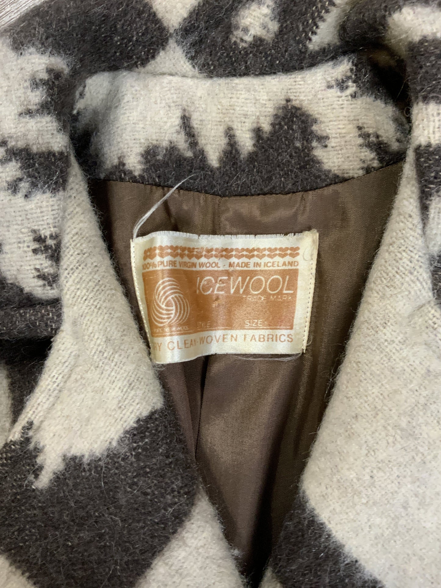 Kingspier Vintage - Icewool 100% pure virgin wool coat. Brown and cream pattern with belt, wooden buttons and a top snap closure. Made in Iceland. Fits size 14.