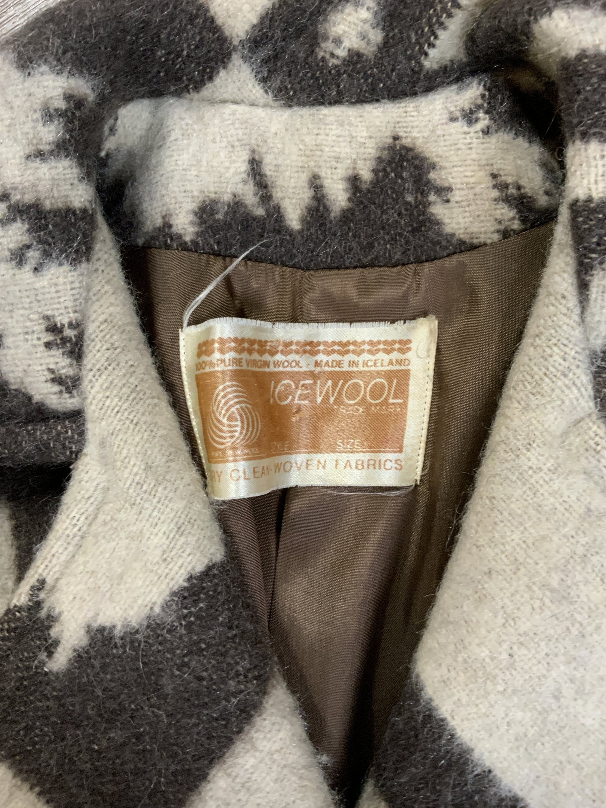 Kingspier Vintage - Icewool 100% pure virgin wool coat. Brown and cream pattern with belt, wooden buttons and a top snap closure. Made in Iceland. Fits size 14.