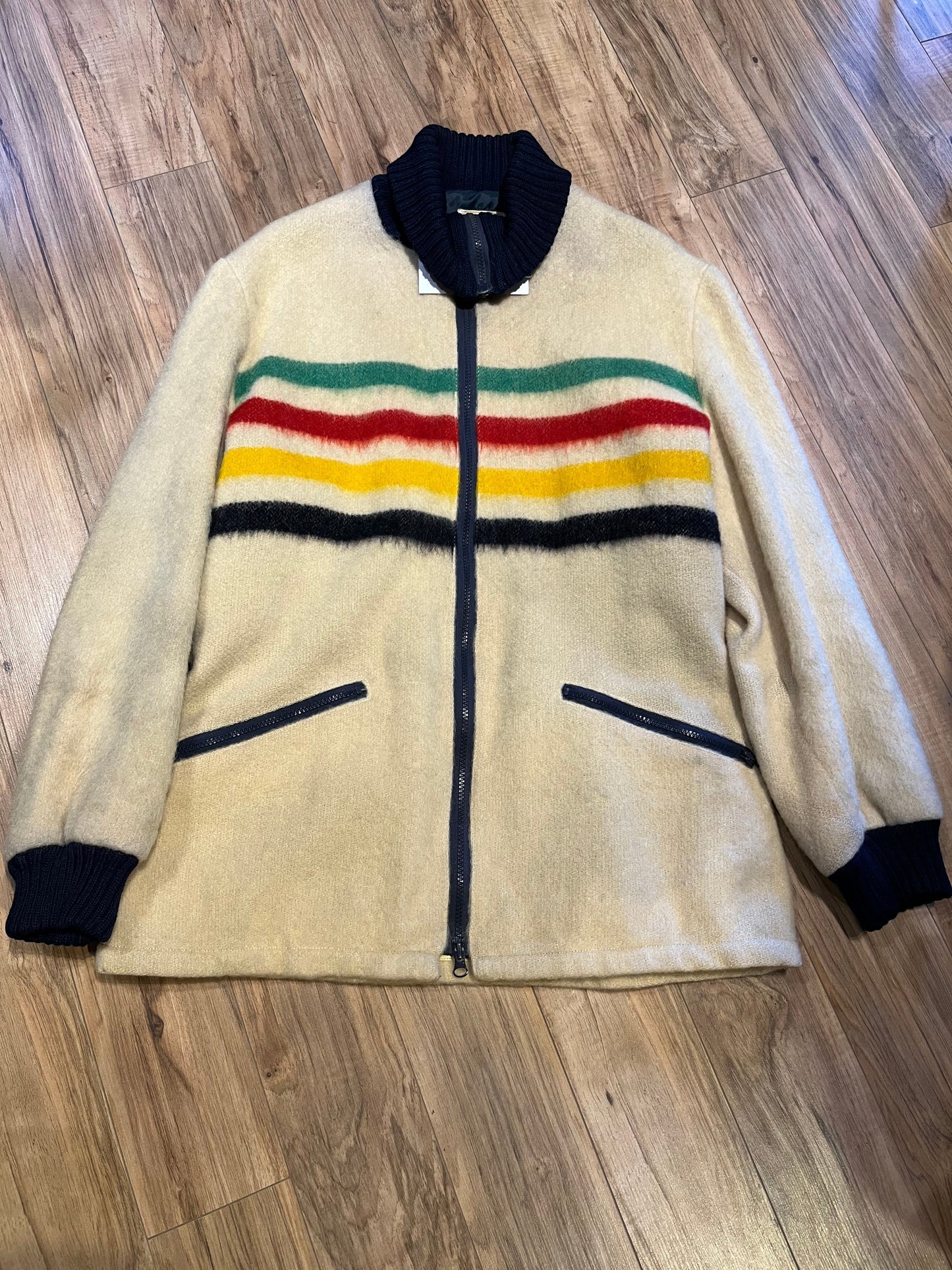 Genuine Hudson’s Bay Company 100% wool point blanket zip cardigan in the iconic multi-stripe colours with two zip front pockets.
Union made in Canada.
Size medium.