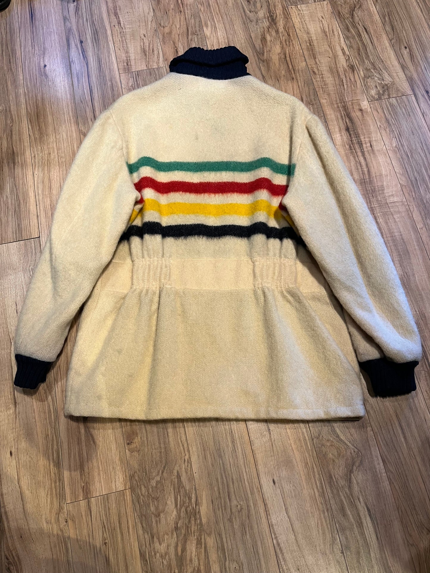 Genuine Hudson’s Bay Company 100% wool point blanket zip cardigan in the iconic multi-stripe colours with two zip front pockets.
Union made in Canada.
Size medium.