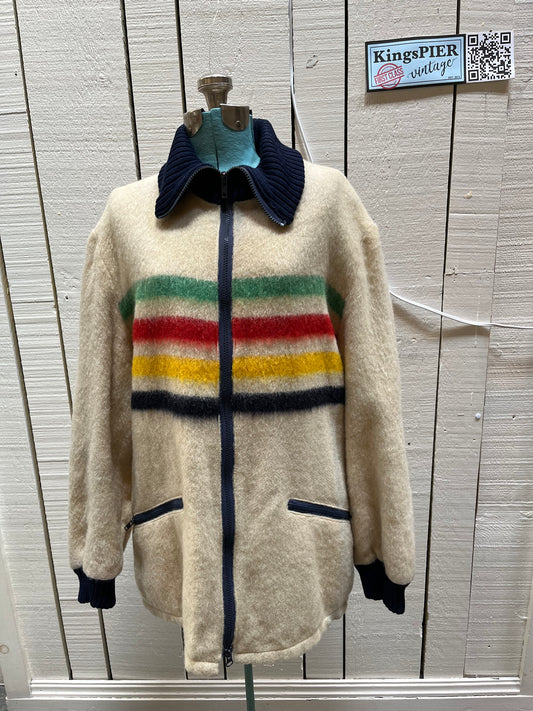 Genuine Hudson’s Bay Company 100% wool point blanket zip cardigan in the iconic multi-stripe colours with two zip front pockets.
Union made in Canada. 
Size medium.