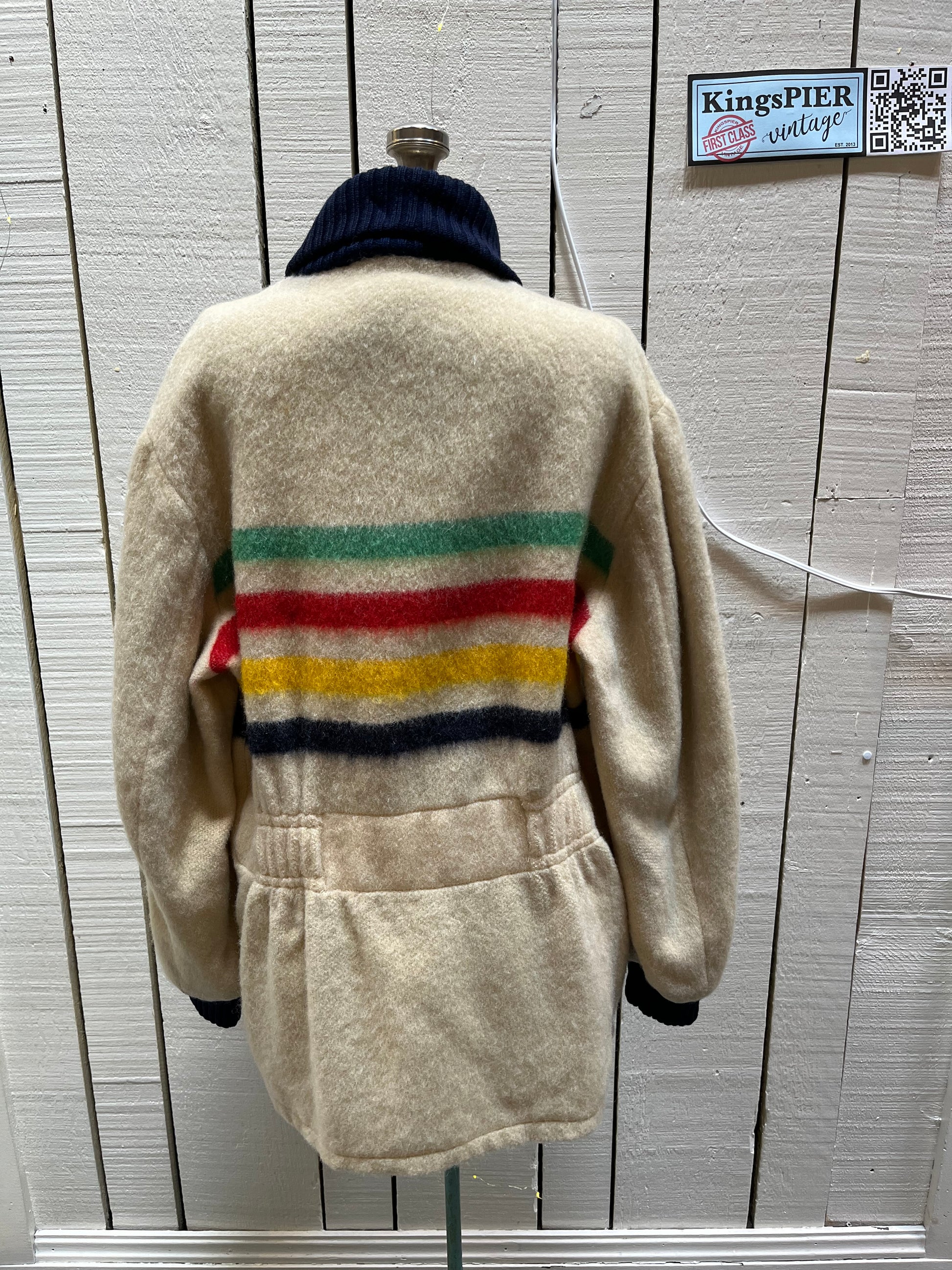Genuine Hudson’s Bay Company 100% wool point blanket zip cardigan in the iconic multi-stripe colours with two zip front pockets.
Union made in Canada. 
Size medium.