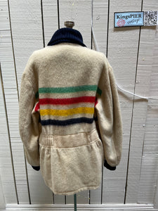 Genuine Hudson’s Bay Company 100% wool point blanket zip cardigan in the iconic multi-stripe colours with two zip front pockets.

Union made in Canada. 
Size medium.
