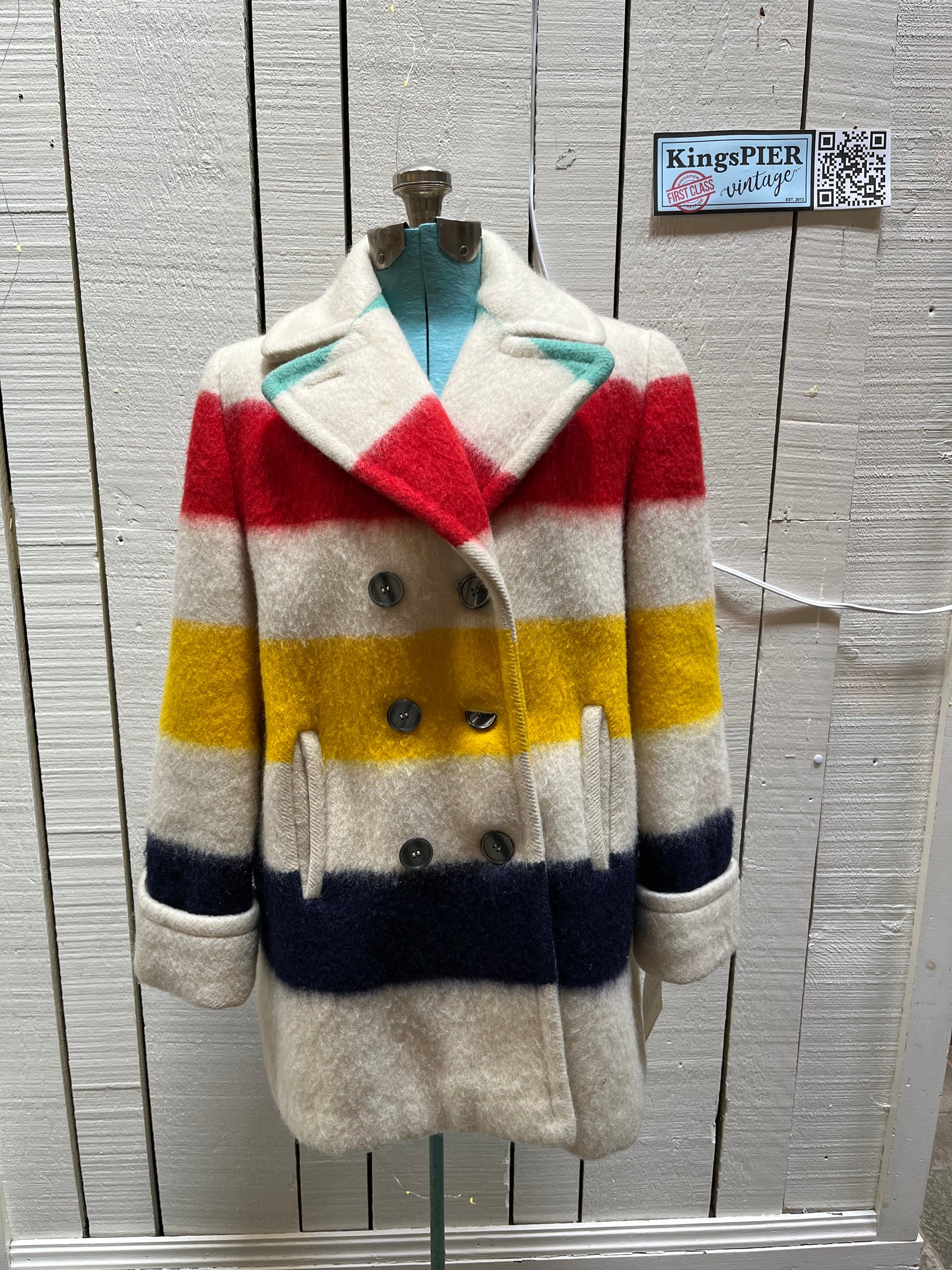 Genuine Hudson’s Bay Company 100% wool point blanket coat in the iconic multi-stripe colours. The coat is double breasted with pockets and a satin lining.
Union made in Canada. 
Chest measures 42”.