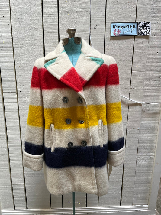 Genuine Hudson’s Bay Company 100% wool point blanket coat in the iconic multi-stripe colours. The coat is double breasted with pockets and a satin lining.
Union made in Canada. 
Chest measures 42”.