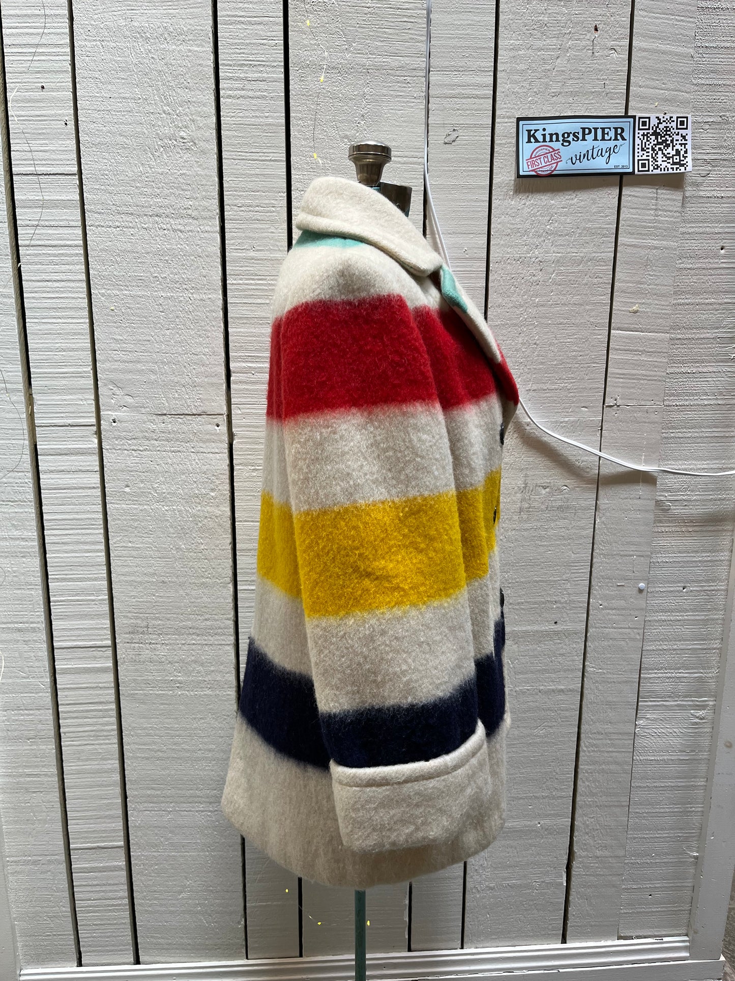 Genuine Hudson’s Bay Company 100% wool point blanket coat in the iconic multi-stripe colours. The coat is double breasted with pockets and a satin lining.
Union made in Canada. 
Chest measures 42”.