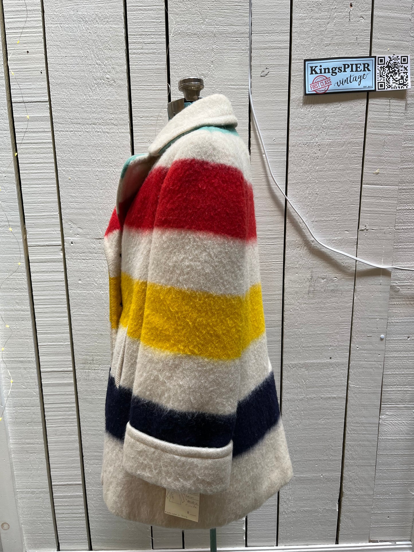 Genuine Hudson’s Bay Company 100% wool point blanket coat in the iconic multi-stripe colours. The coat is double breasted with pockets and a satin lining.
Union made in Canada. 
Chest measures 42”.