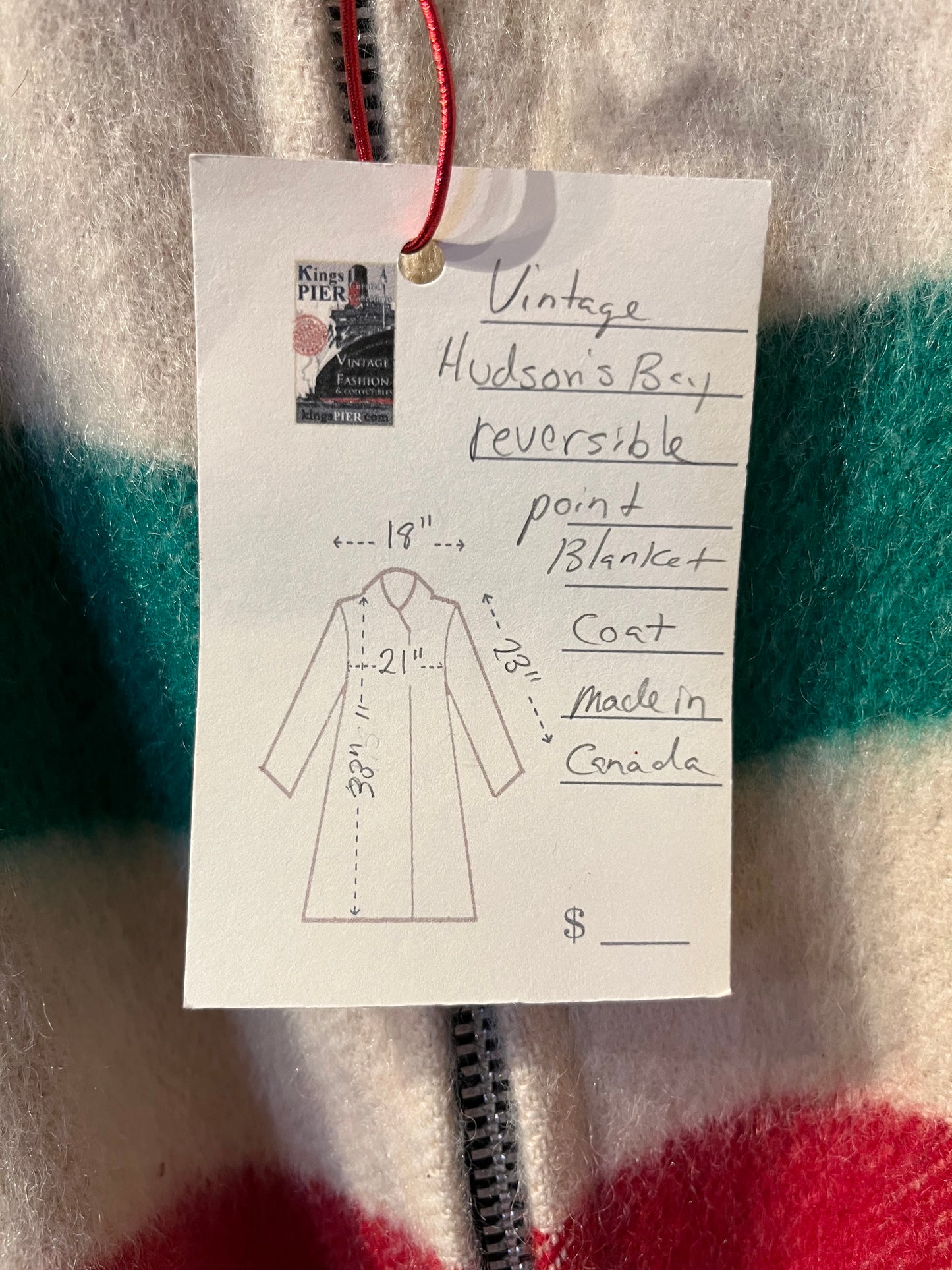 Genuine Hudson’s Bay Company 100% wool point blanket coat in the iconic multi-stripe colours. The coat features a reversible black nylon side with a hood zipped into the collar, zip pockets on both sides and knit cuffs.
Made in Canada.
Chest measures 42”.