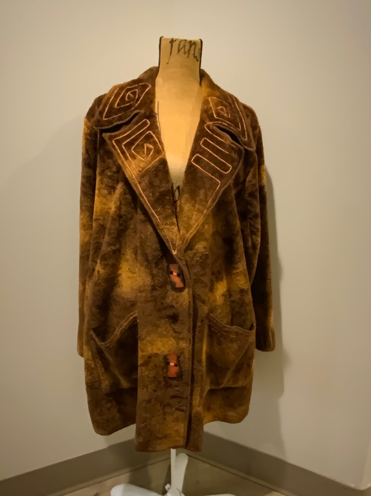 Kingspier Vintage - Linda Lundstrom brown synthetic wool sweater-style coat with geometric design on collar and cuffs, large funky buttons and patch pockets. Made in Canada. Fits a size 14.
