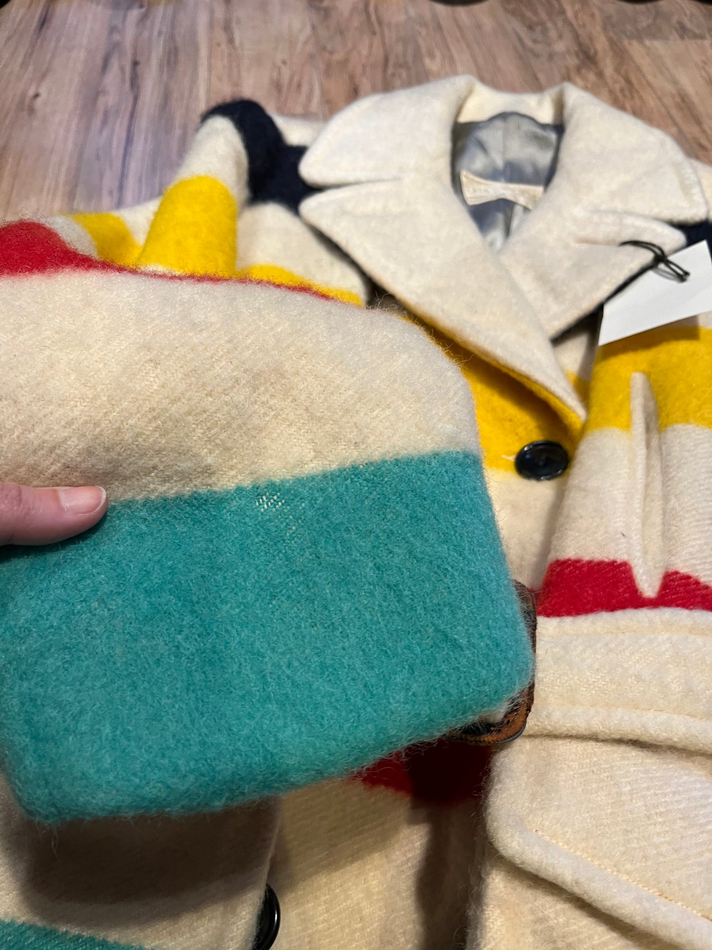 Genuine 1960’s Hudson’s Bay Company 100% wool point blanket coat in the iconic multi-stripe colours. The coat features flap pockets and hand warmer pockets, double breasted button closures and belt.
Made in Canada.
Chest 40”