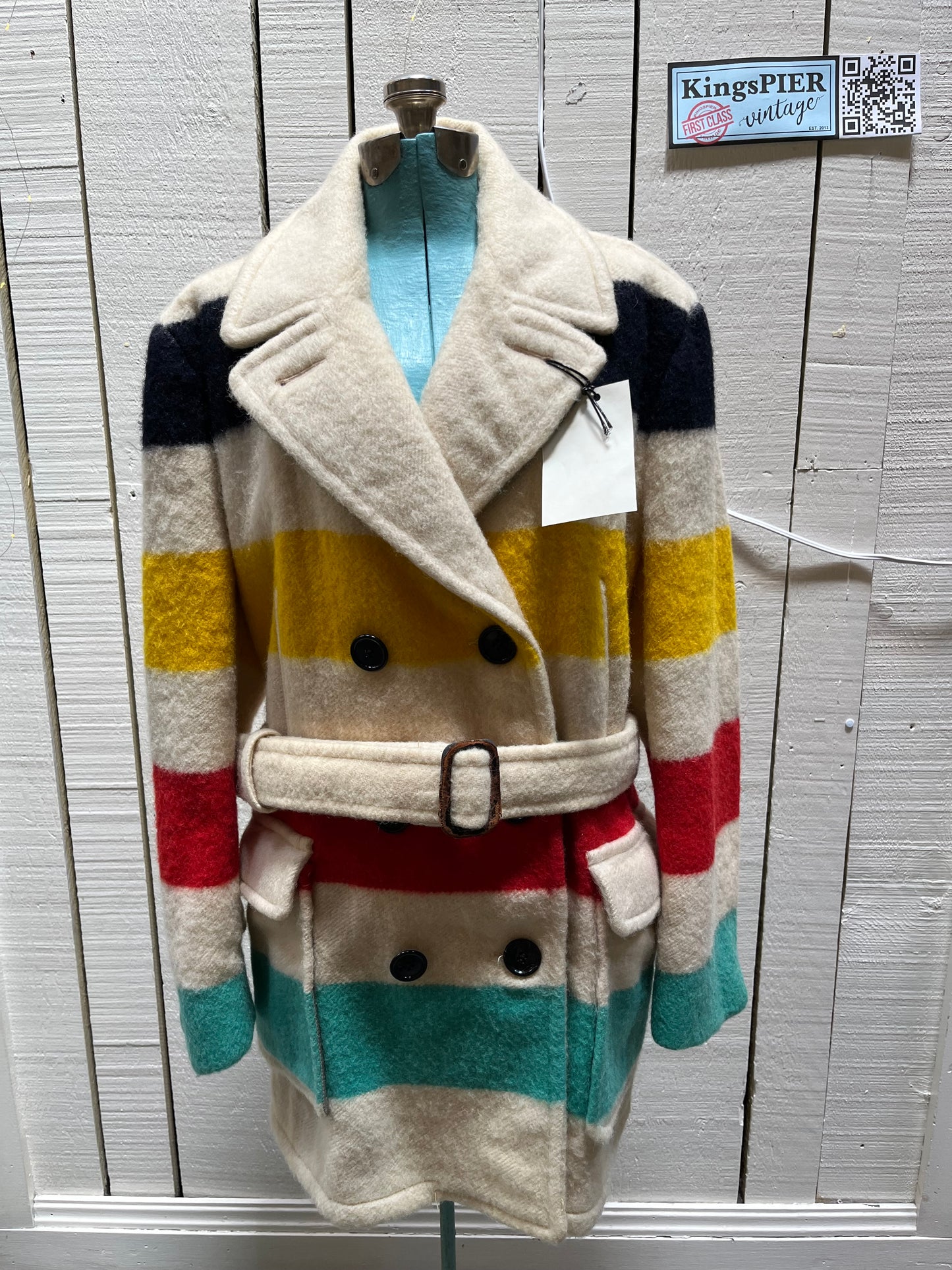 Genuine 1960’s Hudson’s Bay Company 100% wool point blanket coat in the iconic multi-stripe colours. The coat features flap pockets and hand warmer pockets, double breasted button closures and belt.
Made in Canada.
Chest 40”