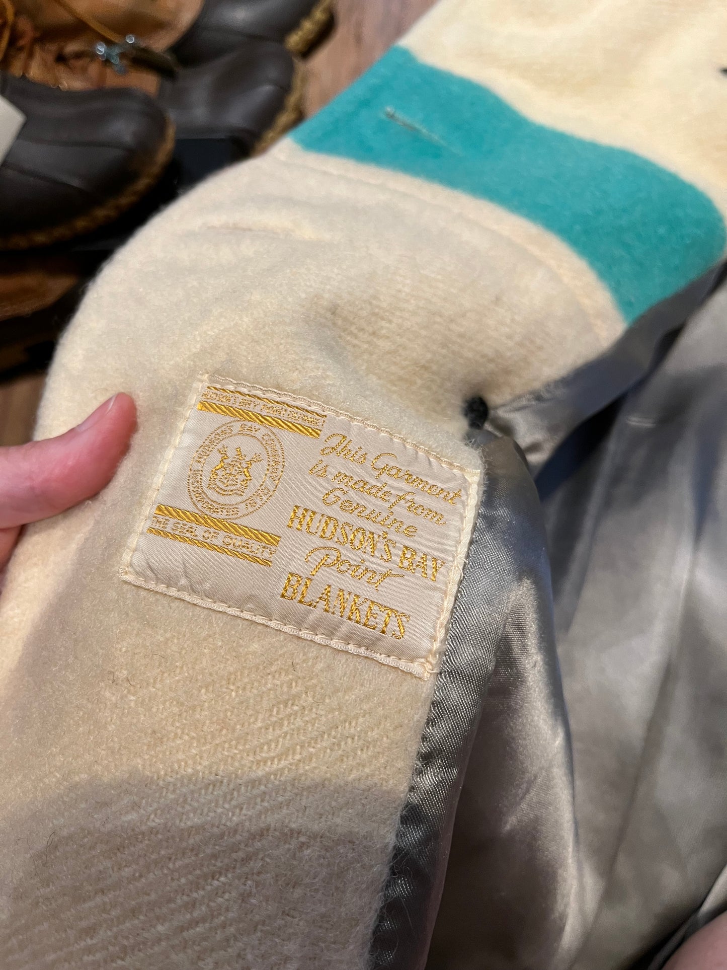 Genuine 1960’s Hudson’s Bay Company 100% wool point blanket coat in the iconic multi-stripe colours. The coat features flap pockets and hand warmer pockets, double breasted button closures and belt.
Made in Canada.
Chest 40”