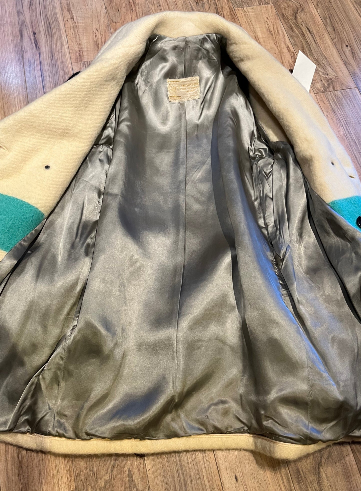 Genuine 1960’s Hudson’s Bay Company 100% wool point blanket coat in the iconic multi-stripe colours. The coat features flap pockets and hand warmer pockets, double breasted button closures and belt.
Made in Canada.
Chest 40”